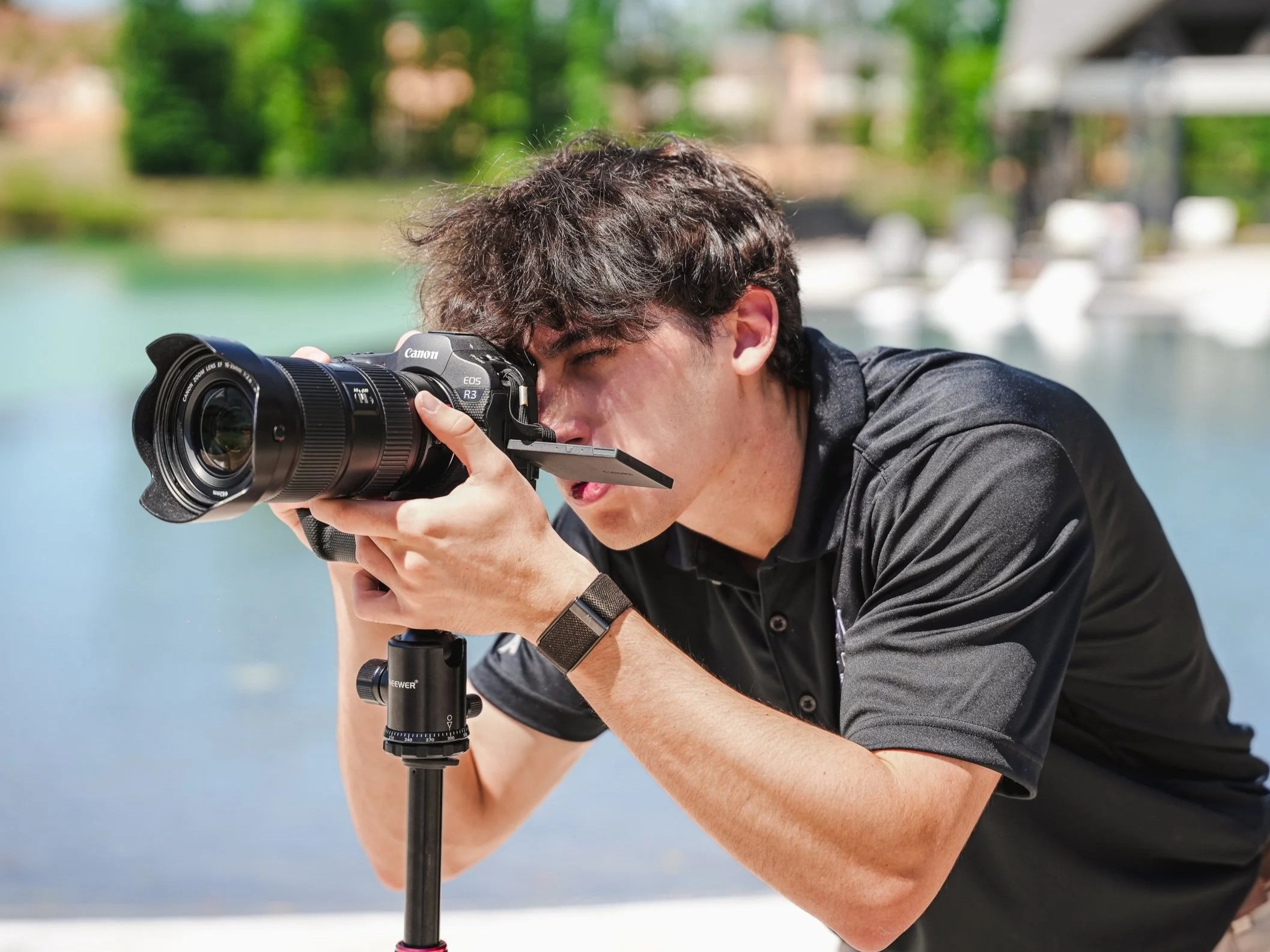 Oxford Marketing Co. photographer Evan Farrell taking photographs outside of Wellington Place, a luxury apartment complex.