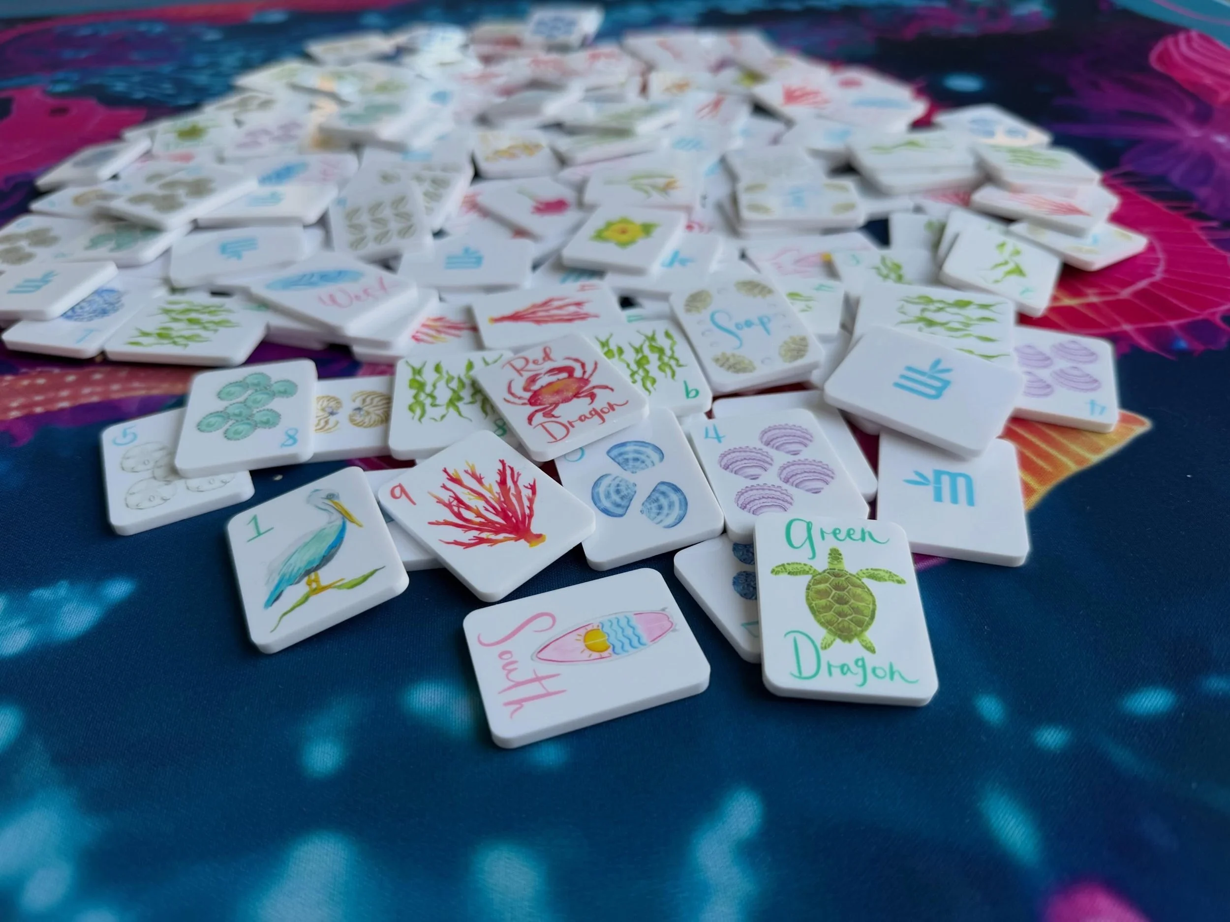 Public service announcement from the Department of Tiny Things That Bring Me Great Joy.

These Beach Edition Mini Mahjer Tiles have arrived, and they are ridiculously cute.

The set comes with the tiles and a sweet little carrying bag, making it an i
