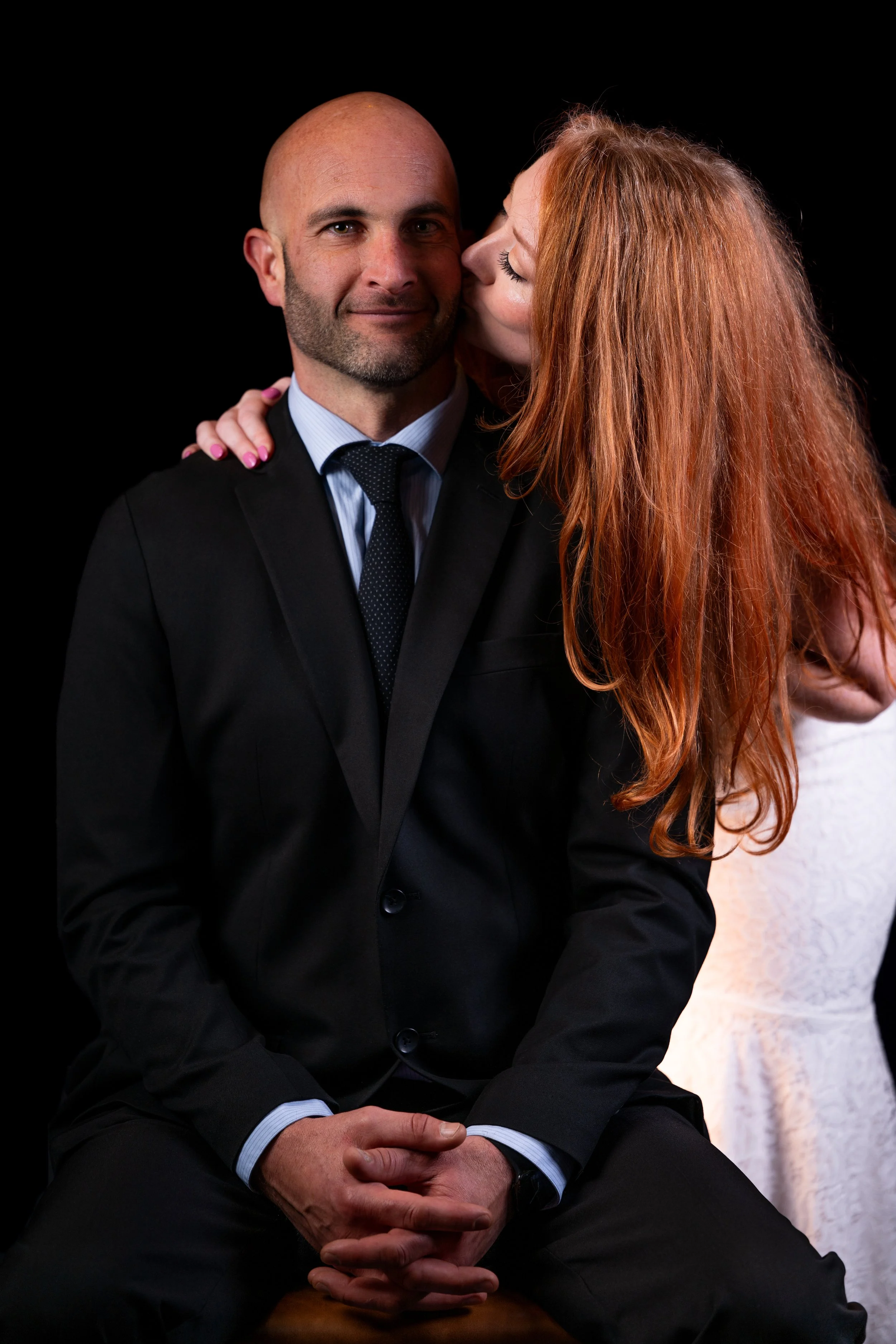 Studio portrait of couple in formal attire