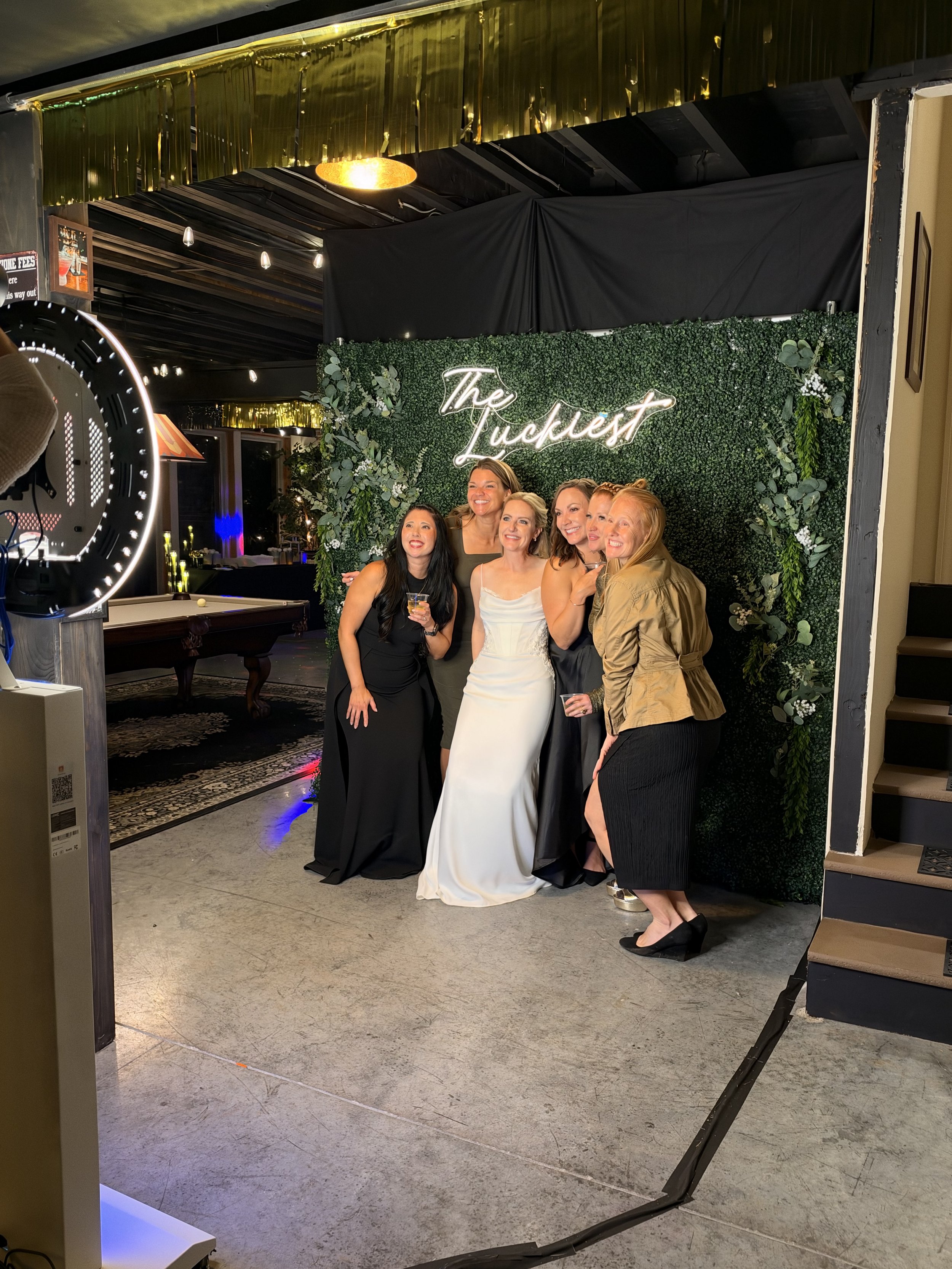 Guests enjoying the Ivory and Vine digital photo booth at a celebration