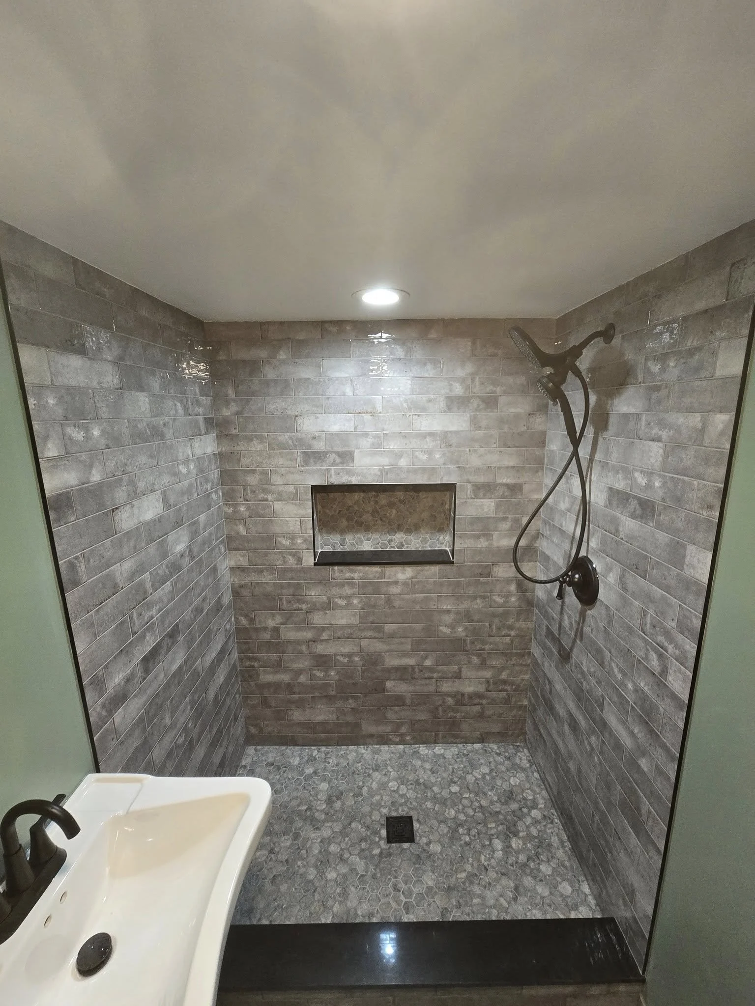 Bathroom remodel with tile shower and custom vanity