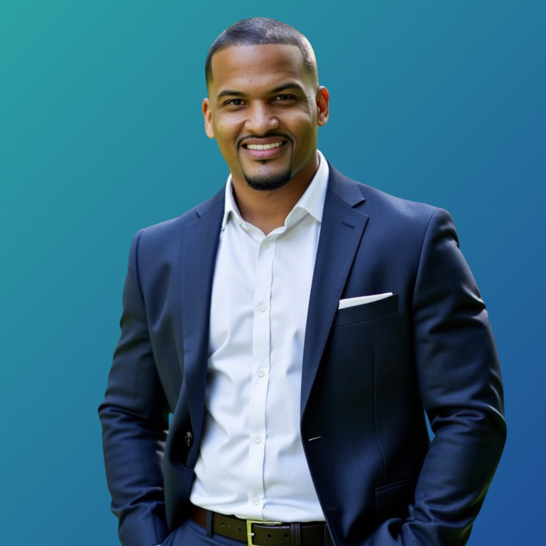 Professional man in a navy suit and white shirt smiling against a blue gradient background.