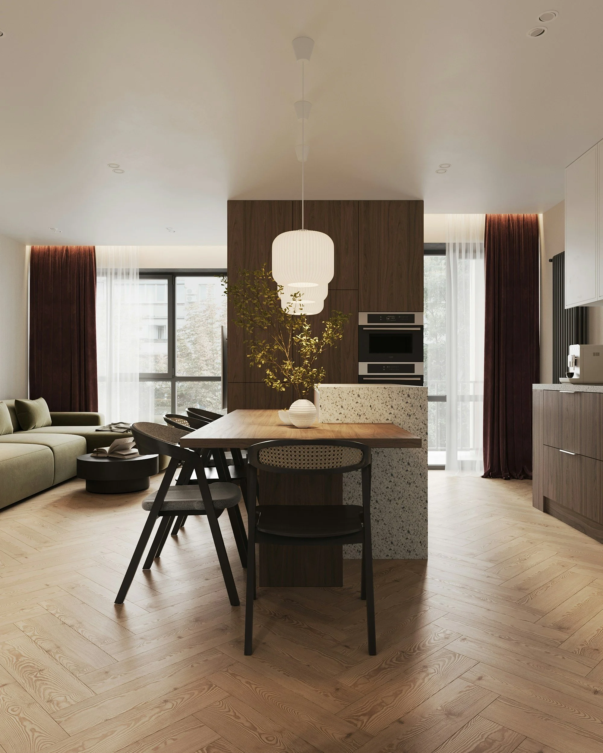 Modern open-plan living room and kitchen area with wooden flooring, a dining table, black chairs, a sofa, curtains, and pendant lights.