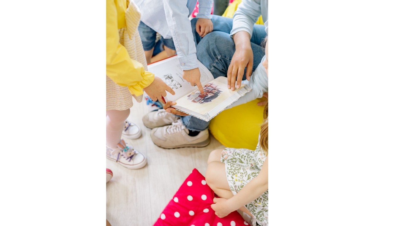 Children participating in a shared book reading with speech-language pathologist in St. Louis, MO