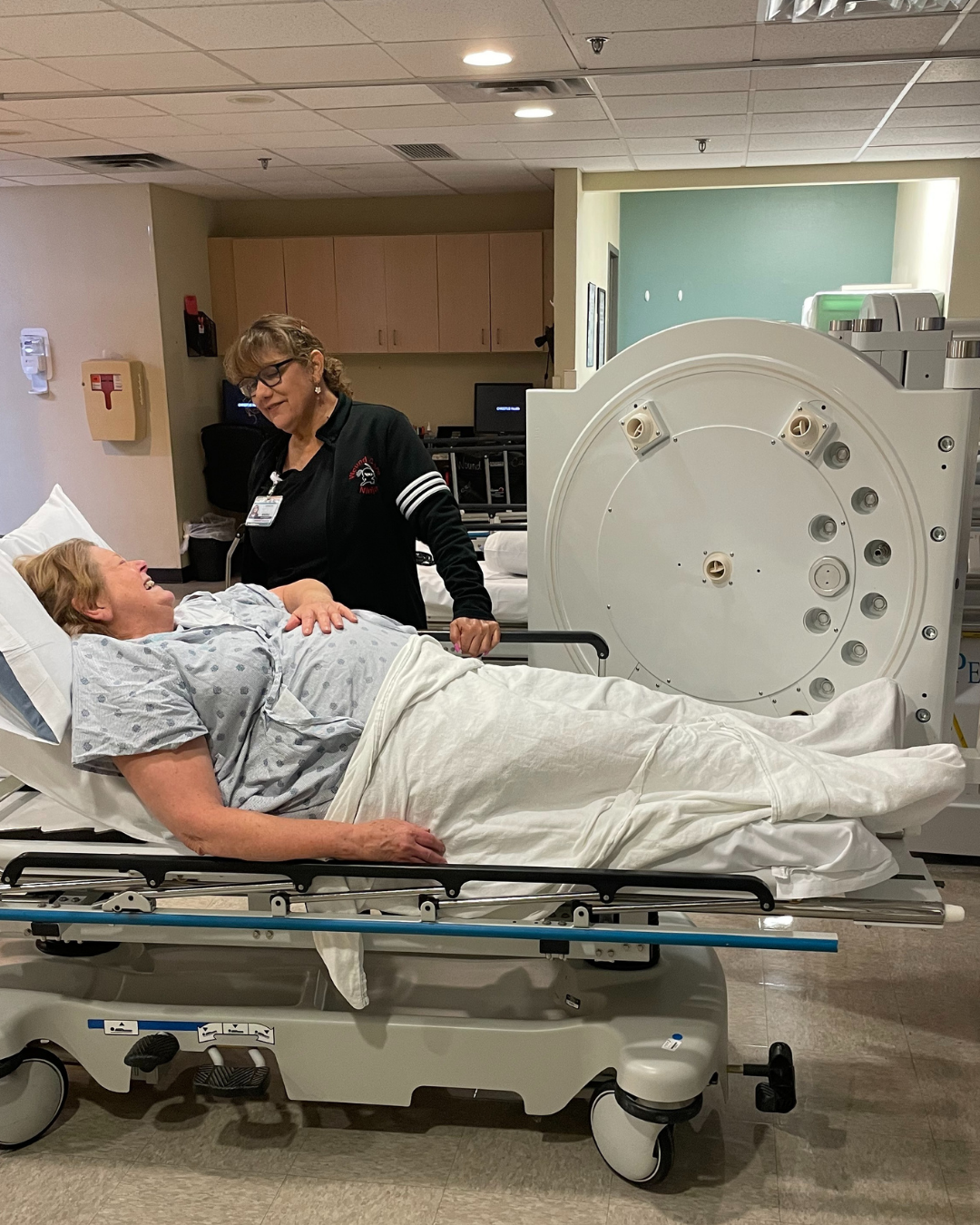 Patient entering a hyperbaric oxygen therapy chamber for treatment at a WoundCentrics wound care enter.