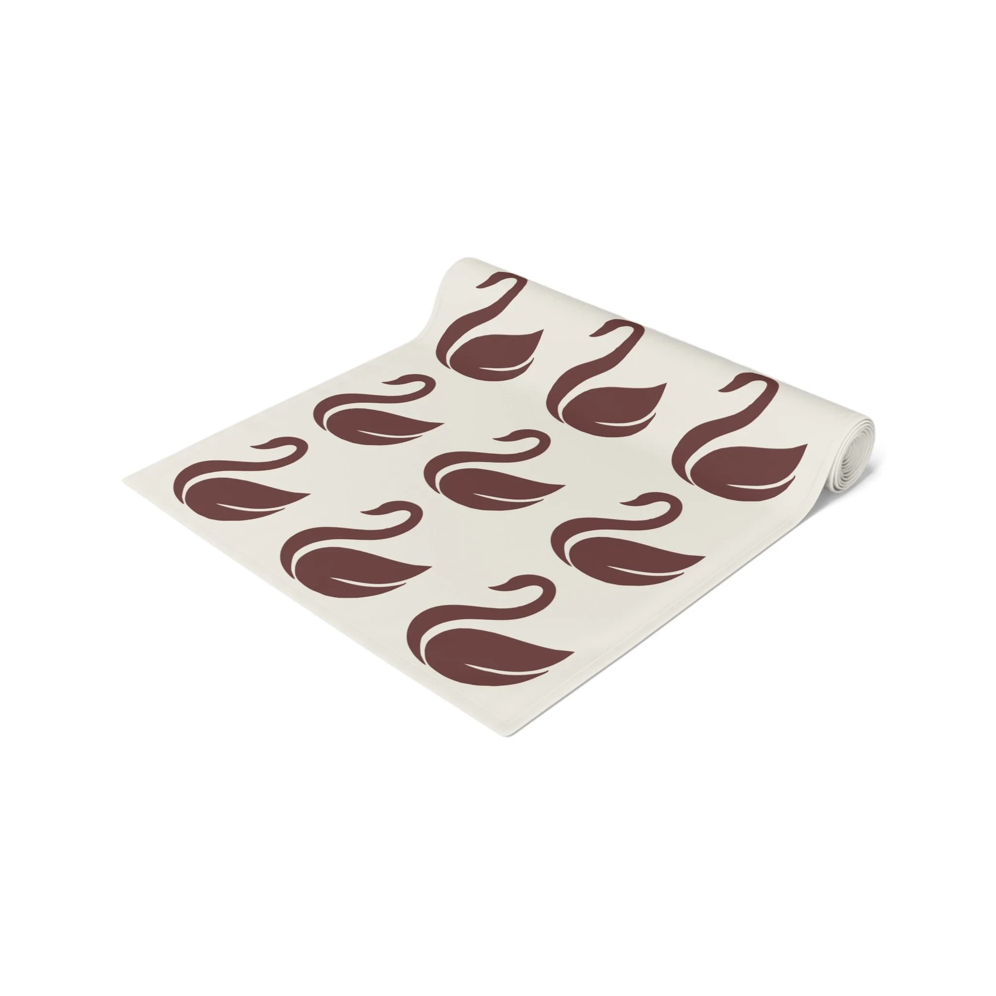 Close-up of swan motif on oxblood table runner