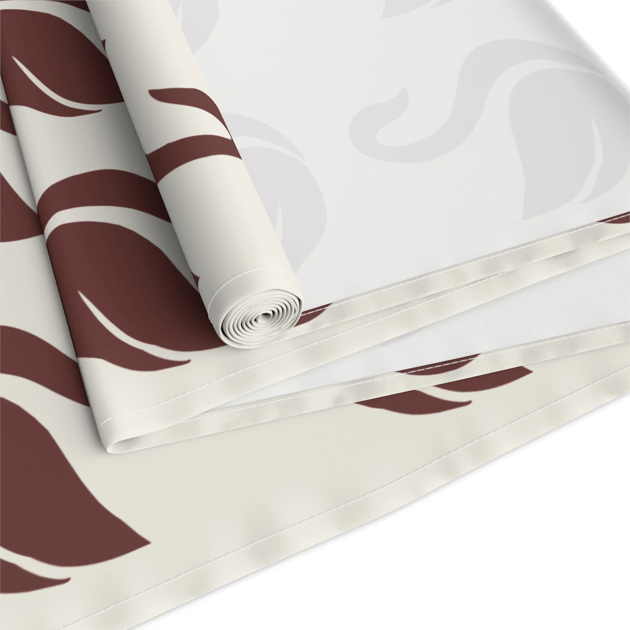 Styled dining table featuring oxblood swan pattern runner