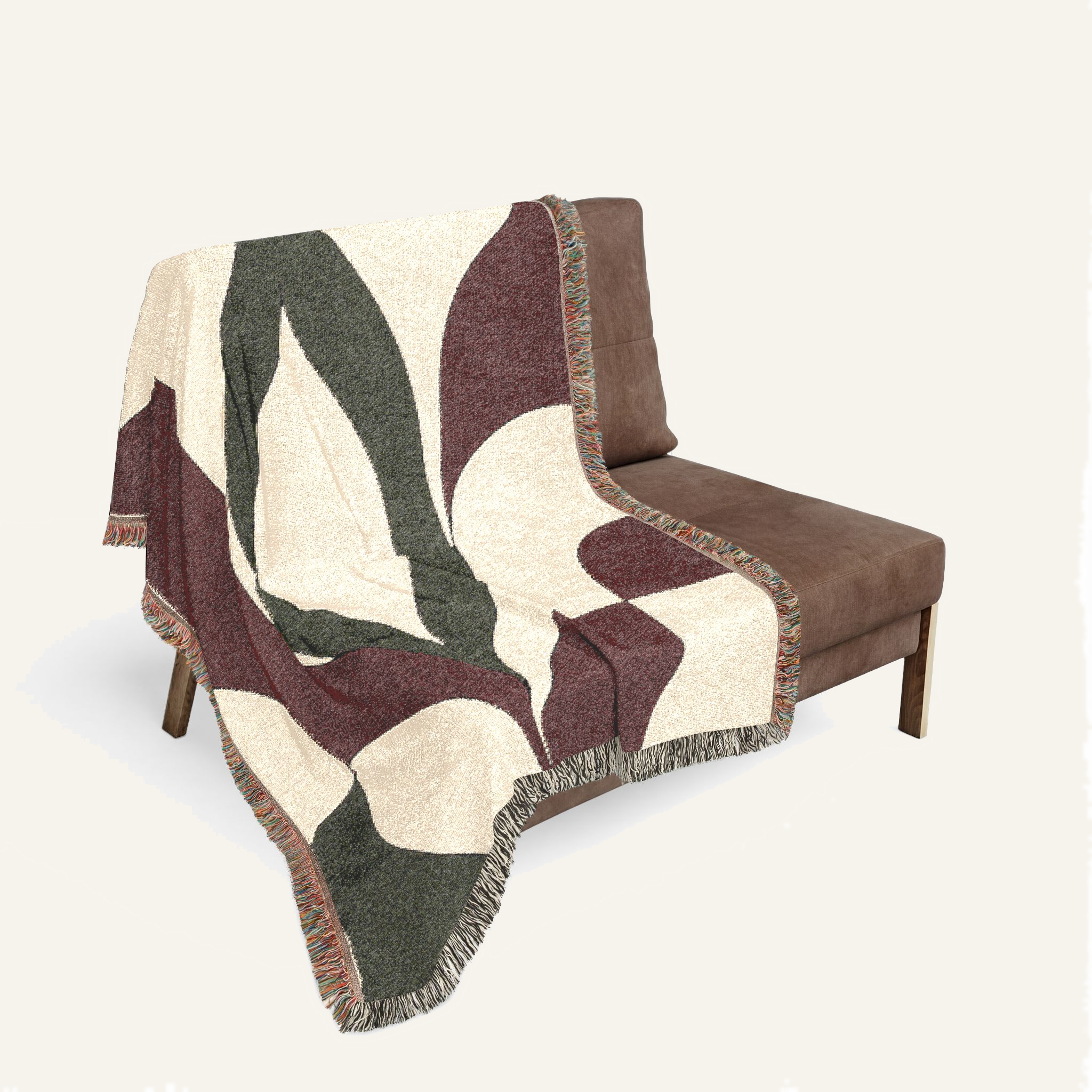 Cygnus woven blanket draped over a sofa in a modern living room