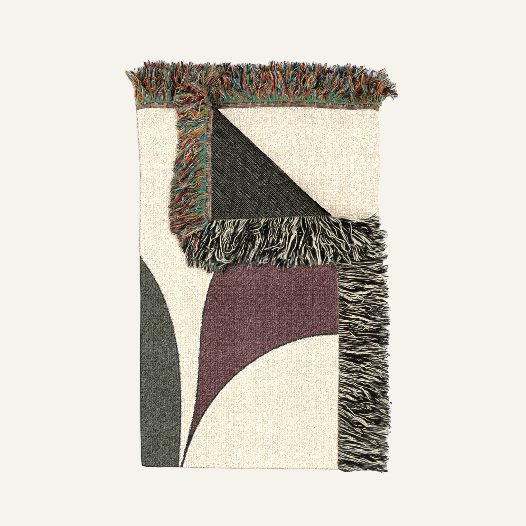 Folded Cygnus Swan Sculpture woven blanket showing fringed edges