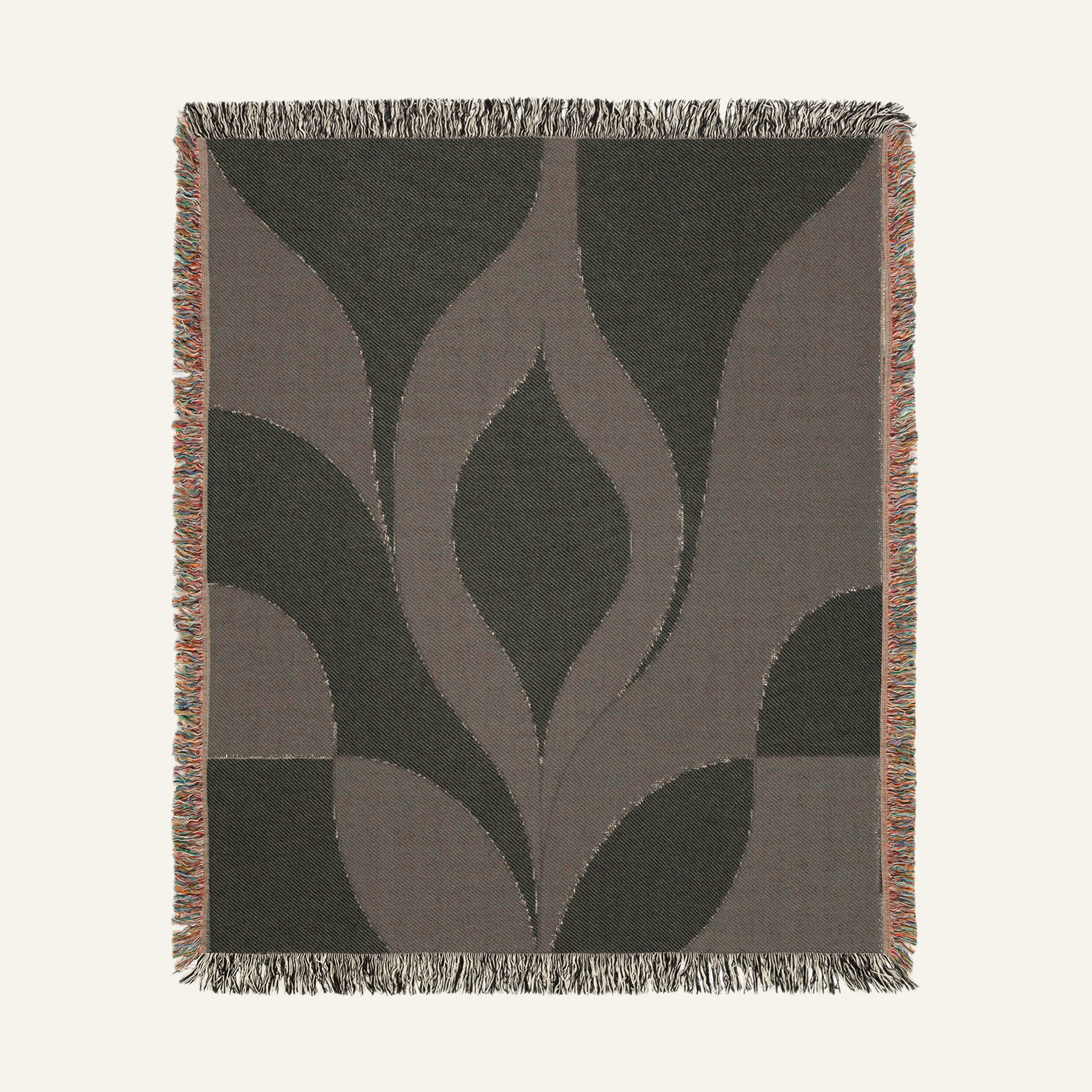 Close-up of woven texture and colorful fringed edges on Cygnus blanket