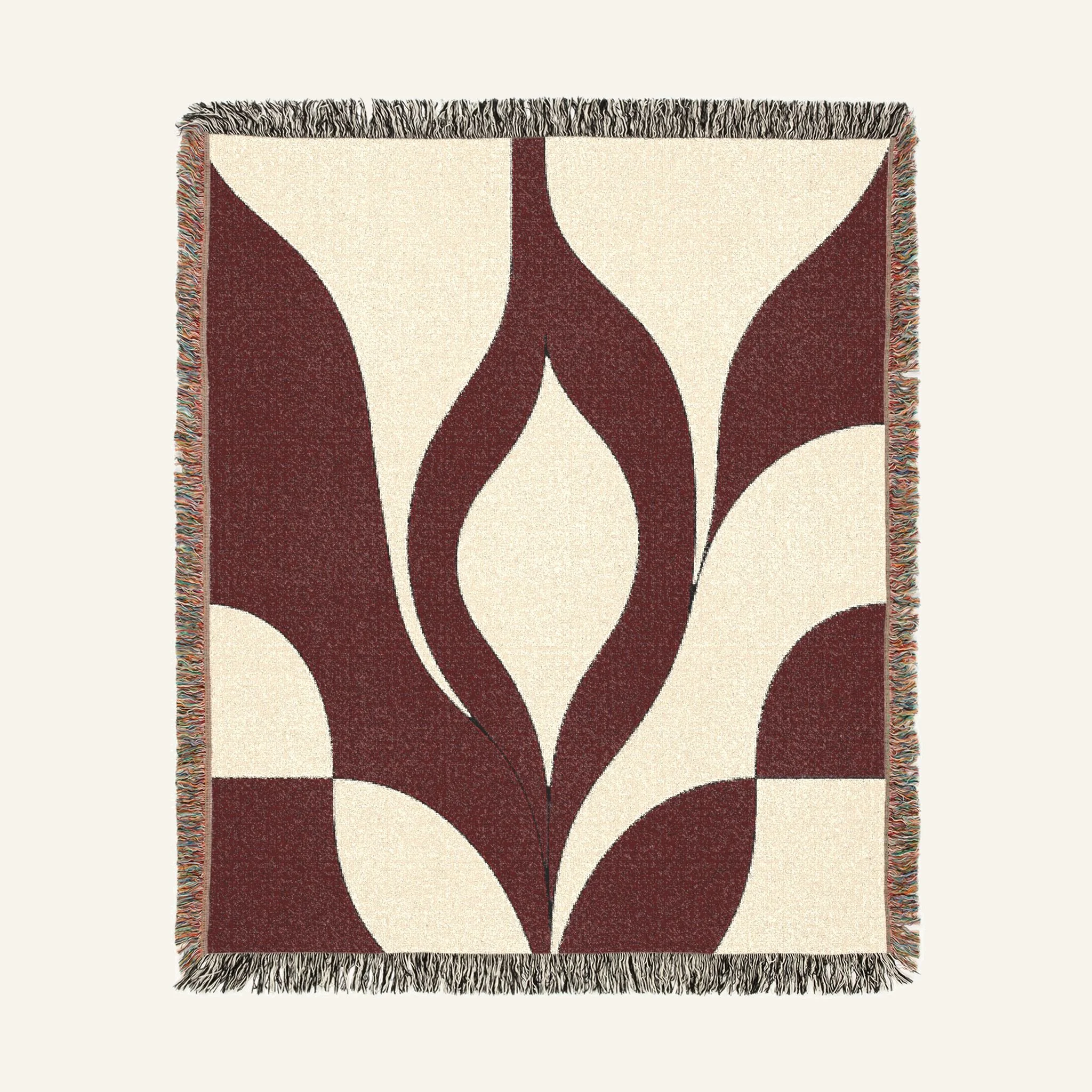 Serein Japandi oxblood geometric woven blanket folded on sofa