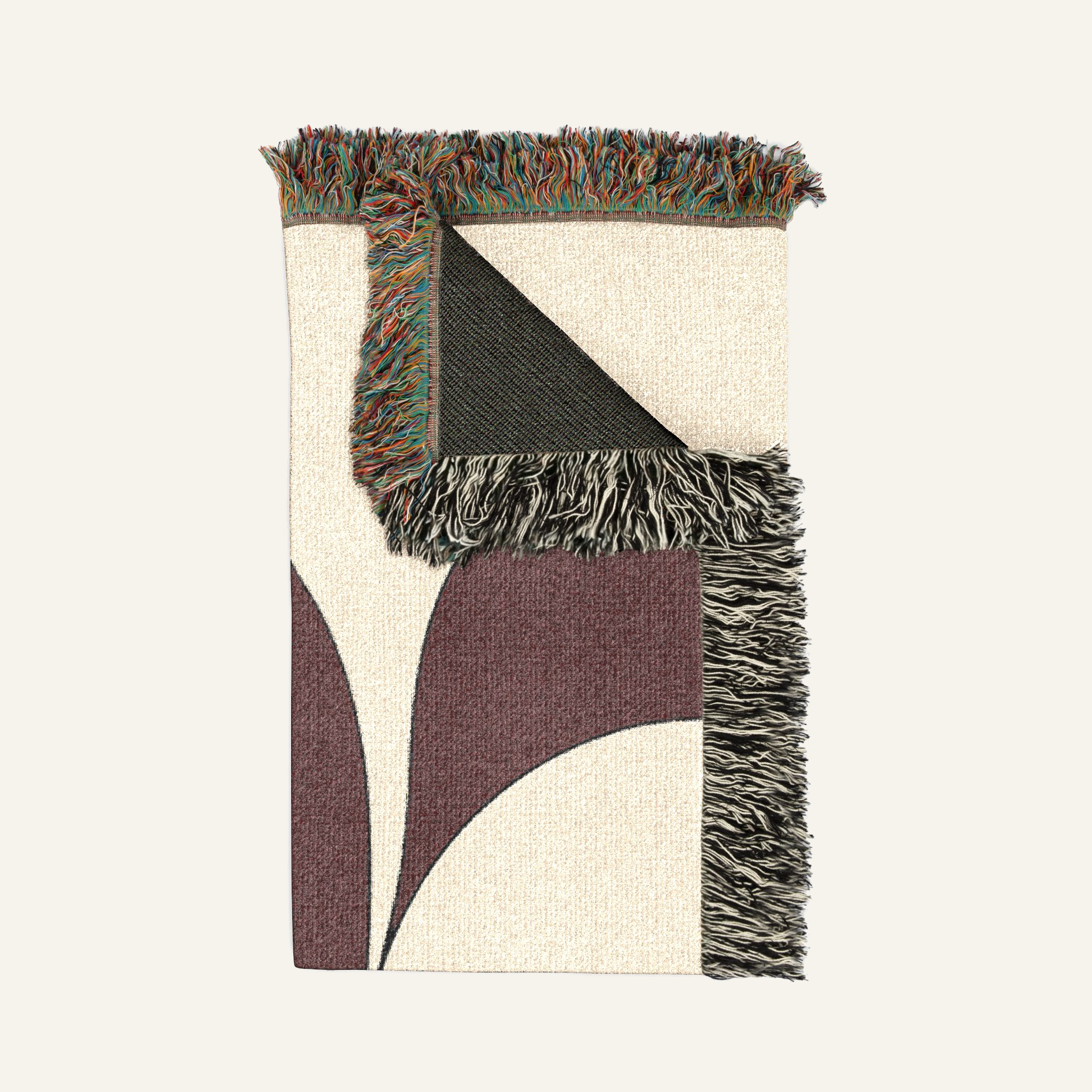 Close-up of colorful fringed edges on Serein Japandi woven blanket