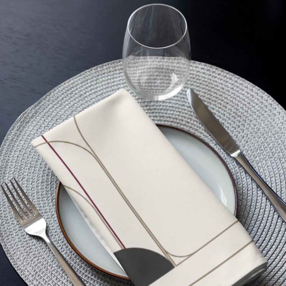 Ivory cloth napkin with hemmed edges displayed with neutral ceramics