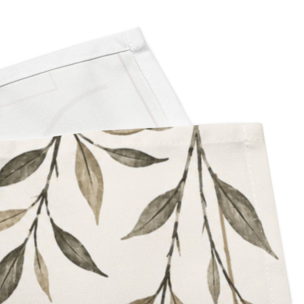 Ivory cloth napkin with japandi floral design next to ceramic plate