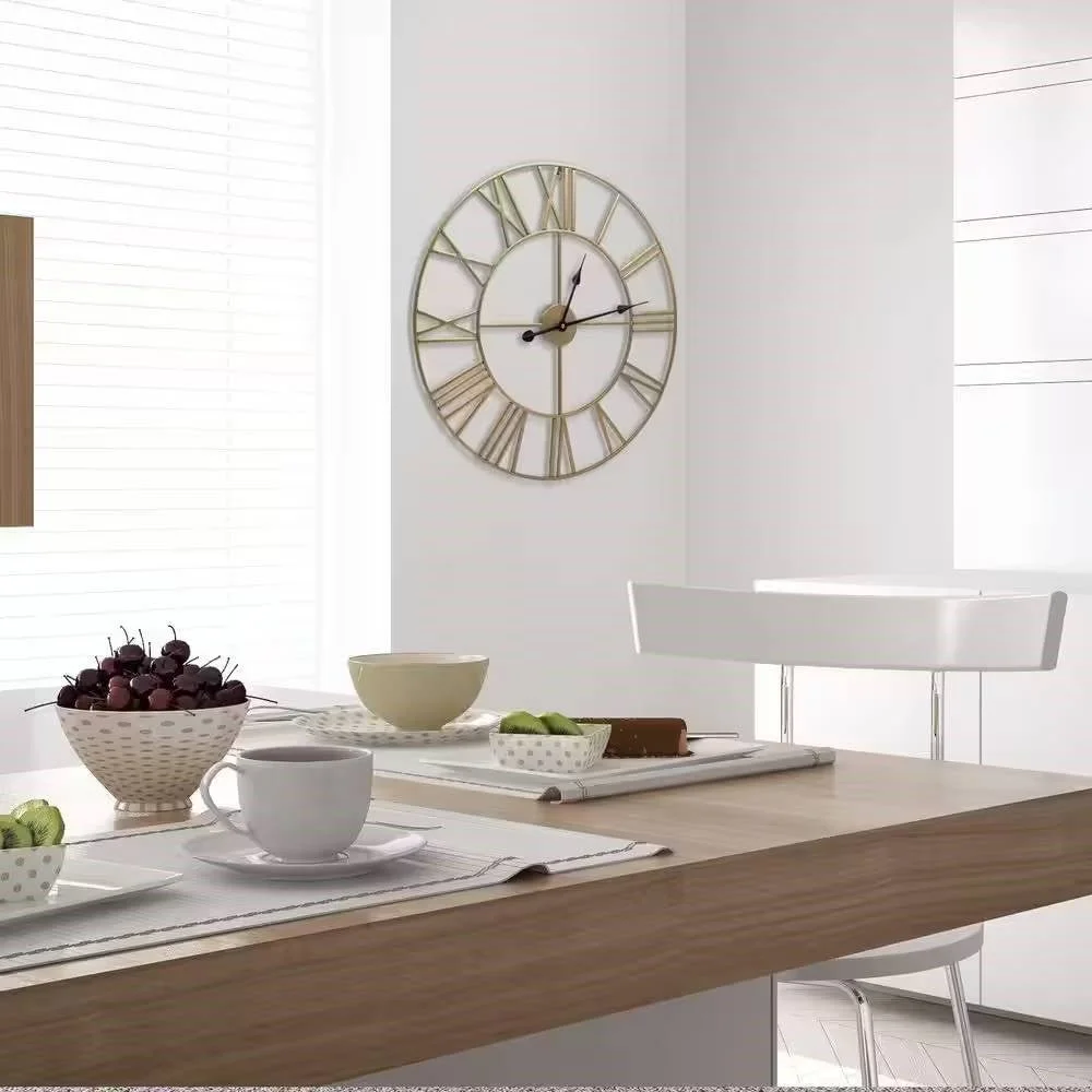 Close-up of Roman numerals and black hands on gold metal wall clock