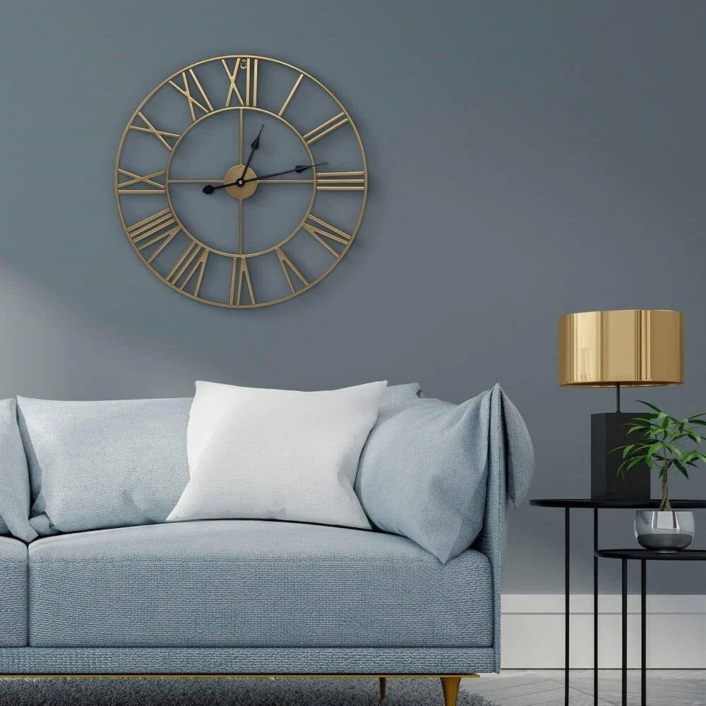 24-inch decorative gold metal wall clock hanging on wall