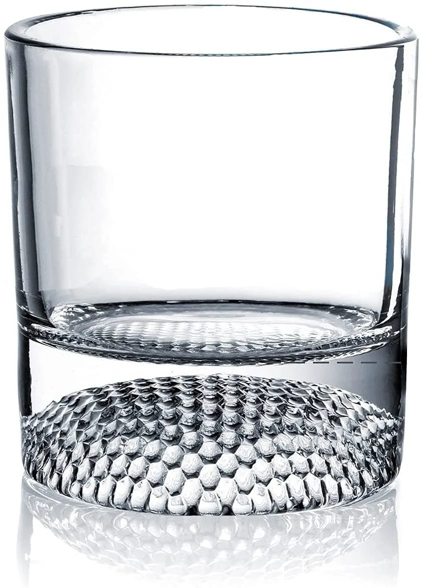Golf ball whiskey glasses displayed on a bar cart