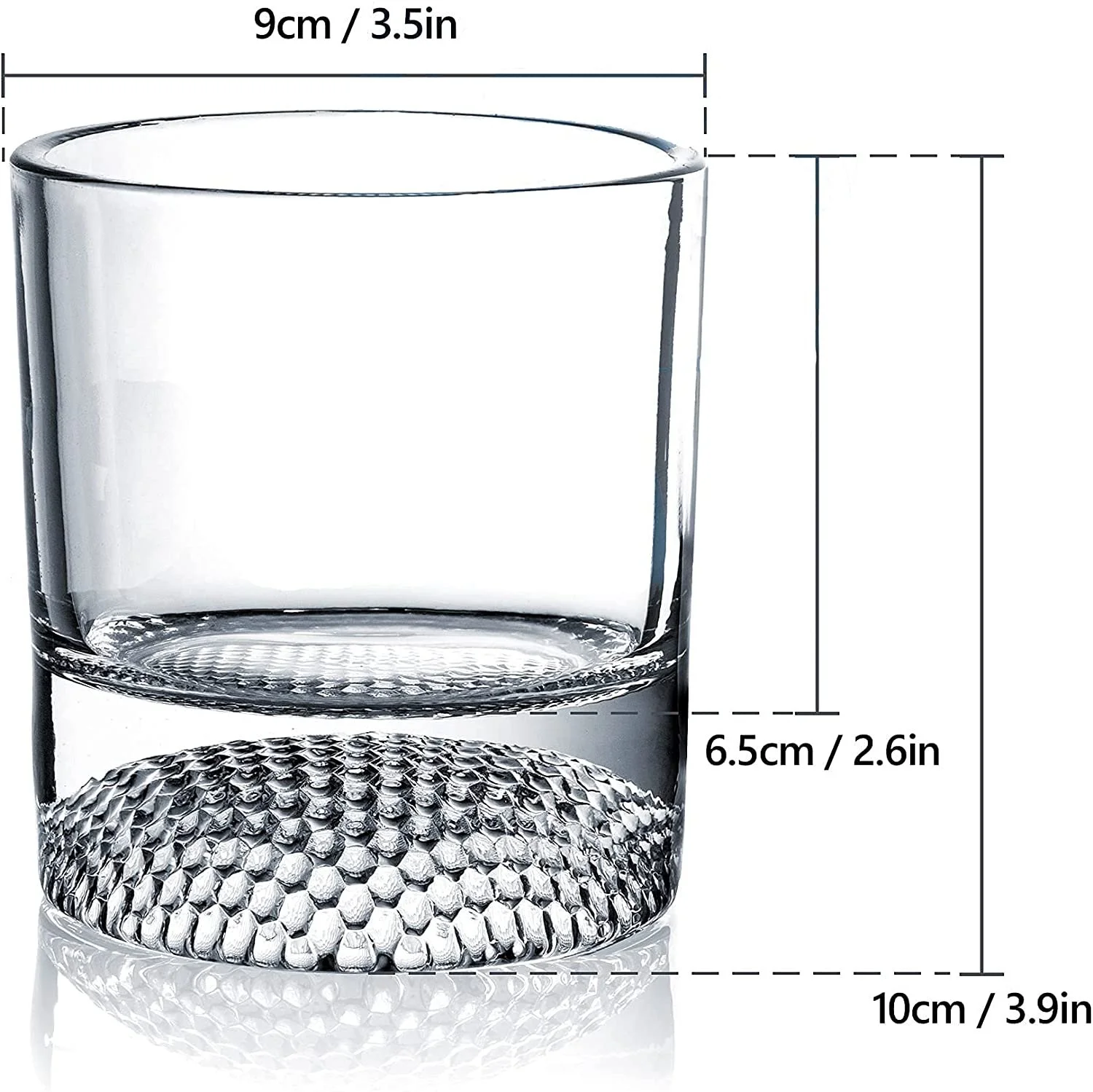 Single golf ball whiskey glass with whiskey and ice