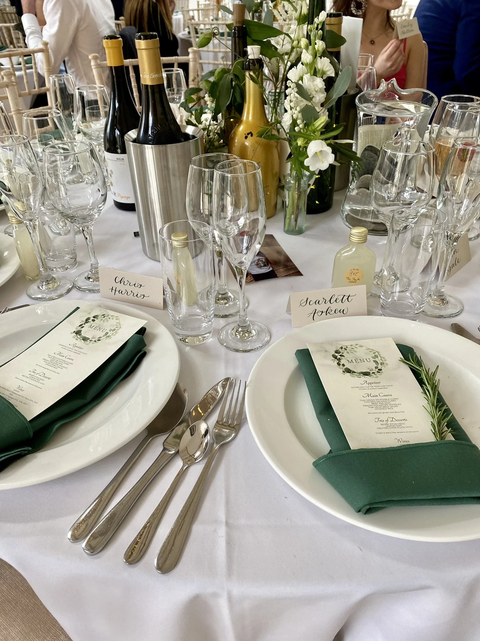 Wedding table settings with calligraphy place cards