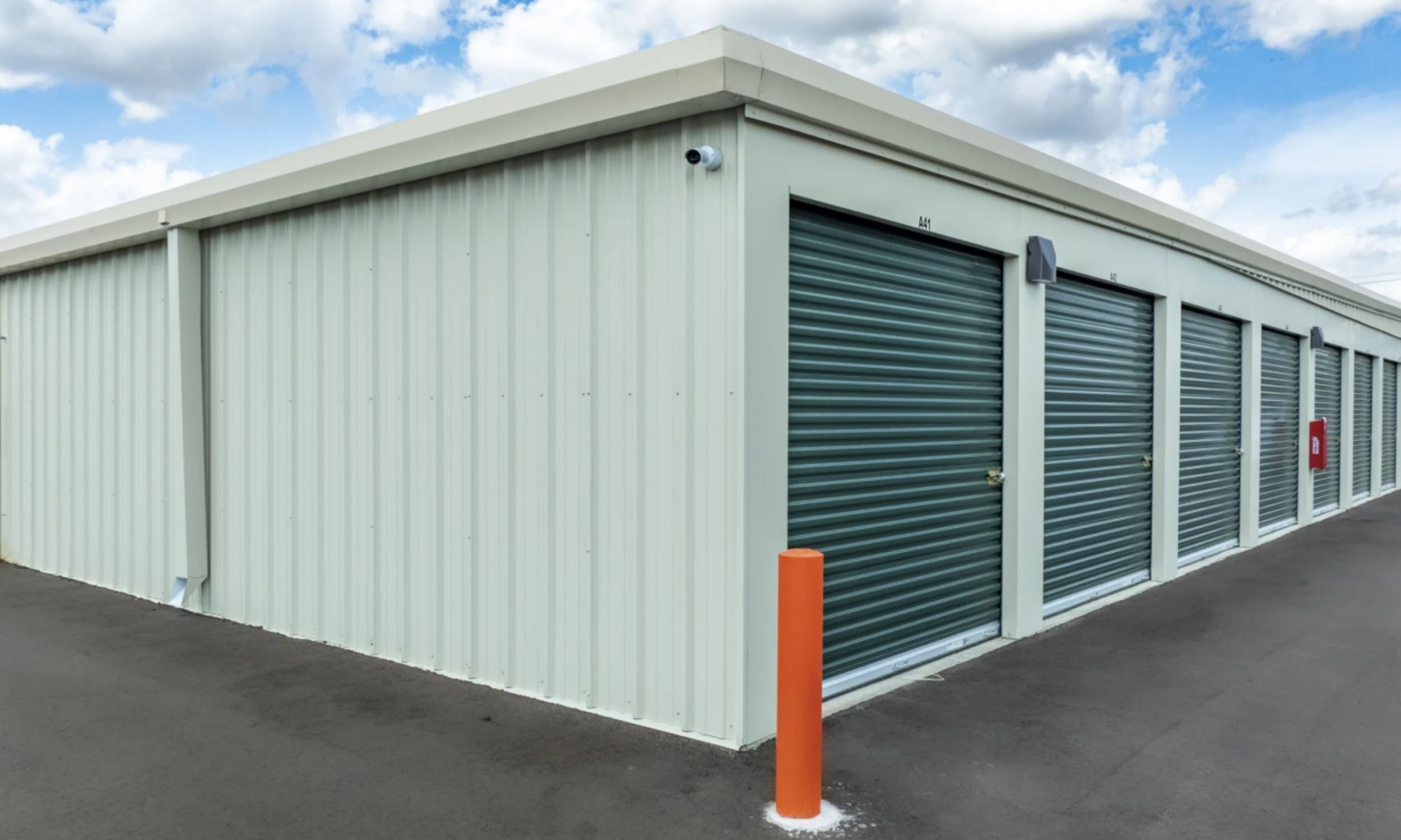 Public Storage building exterior designed by LAT34 Architecture with metal siding, roll-up unit doors, and durable commercial materials.