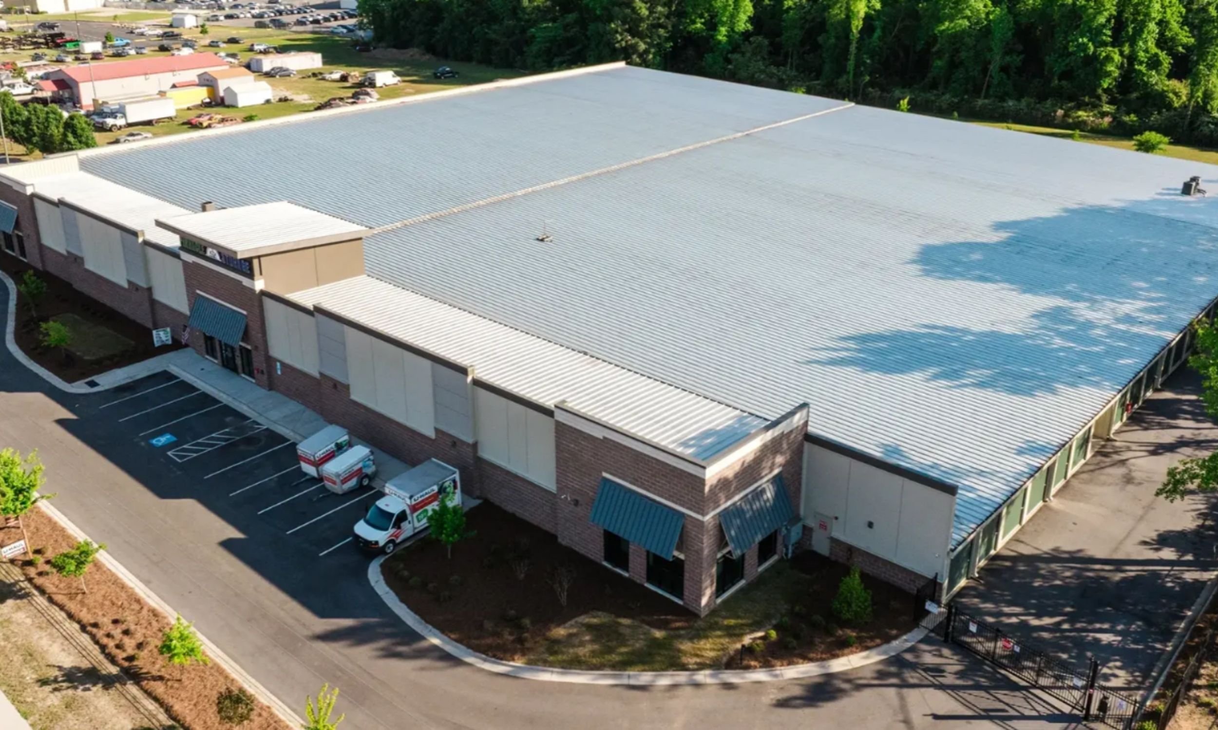 Aerial view of Pinnacle Commercial Project in Wilmington NC by LAT34 Architecture showing a large commercial storage building and site access.