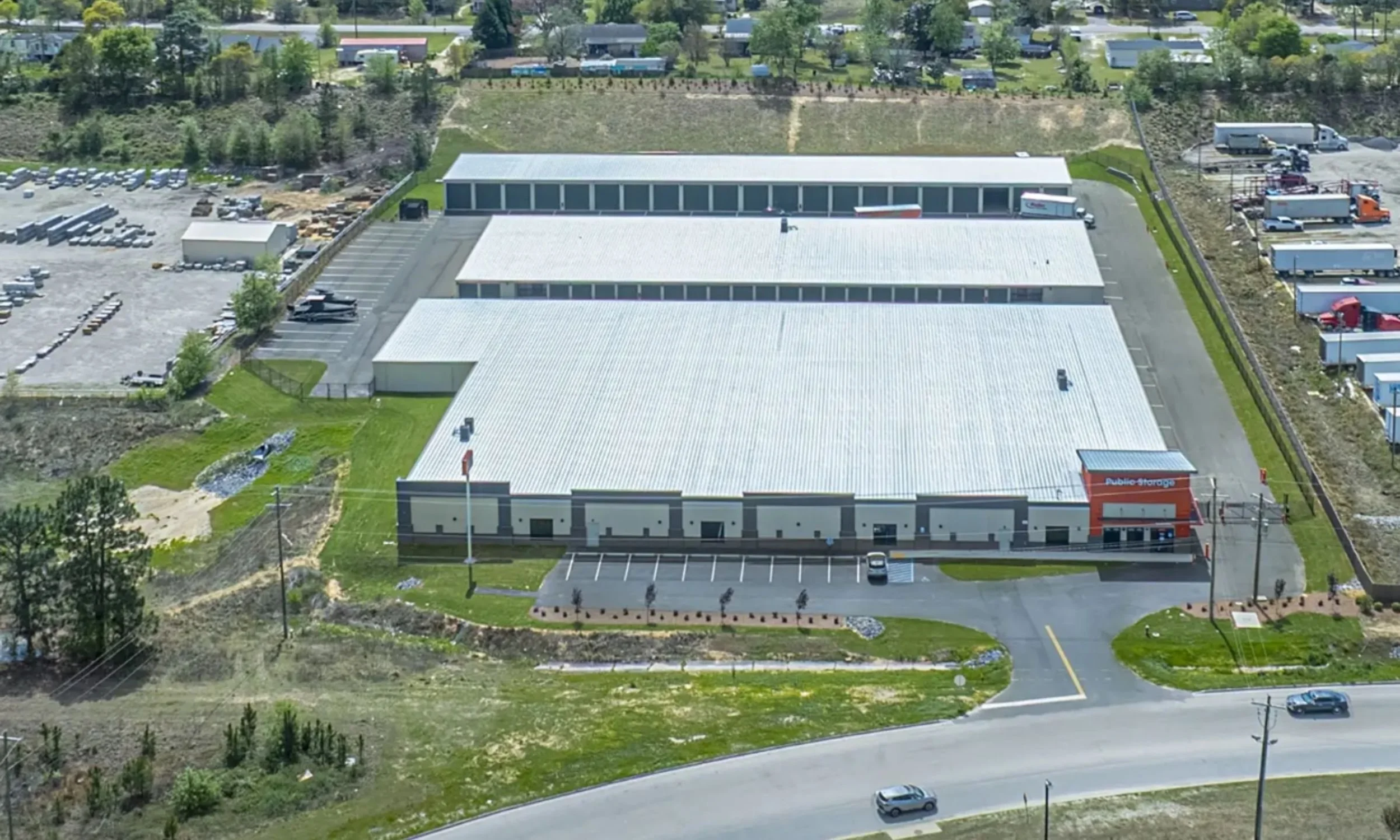 Aerial view of Public Storage commercial self-storage facility designed by LAT34 Architecture with rental office, storage buildings, and secure access.