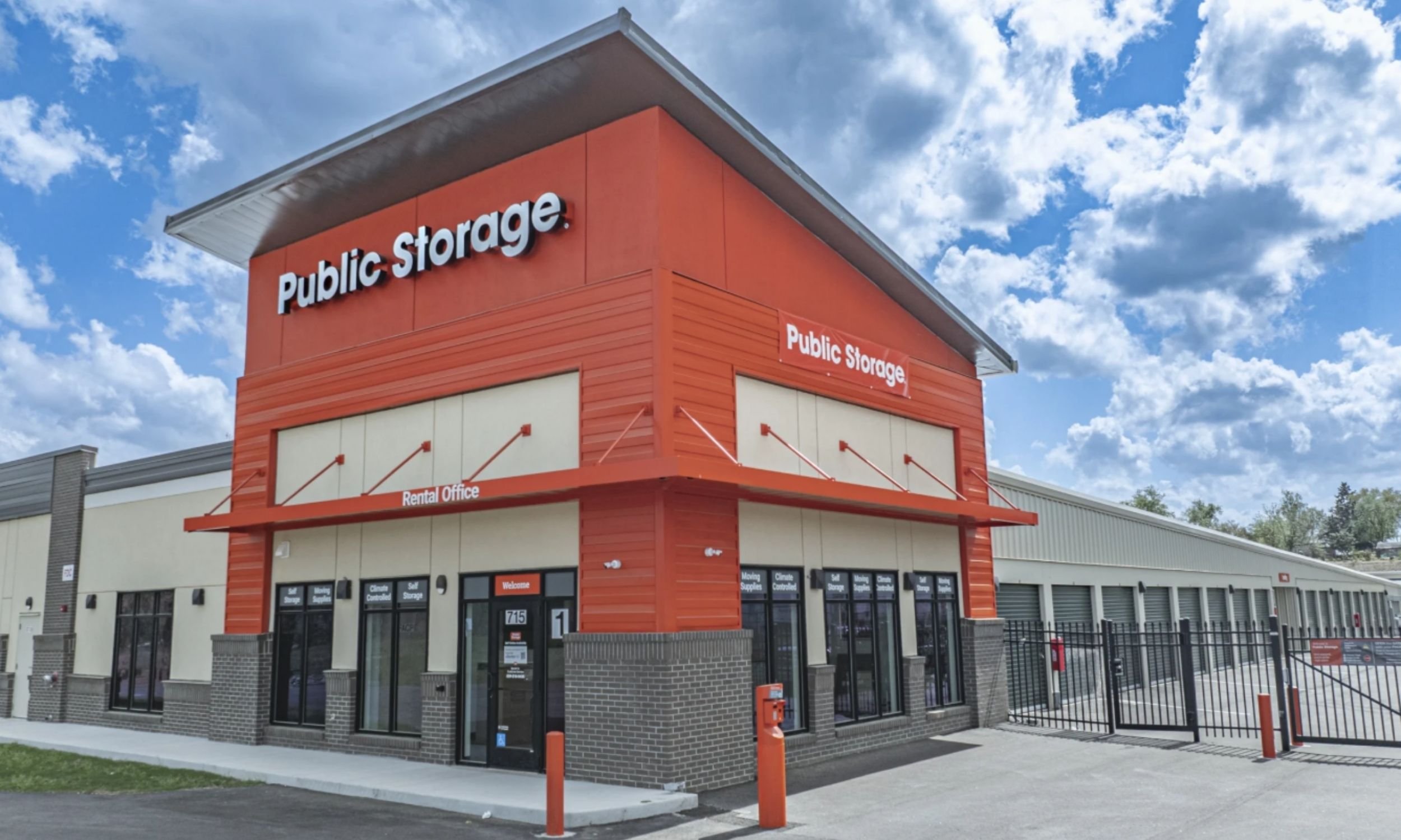 Public Storage facility rental office exterior designed by LAT34 Architecture with modern commercial facade and secured storage access.