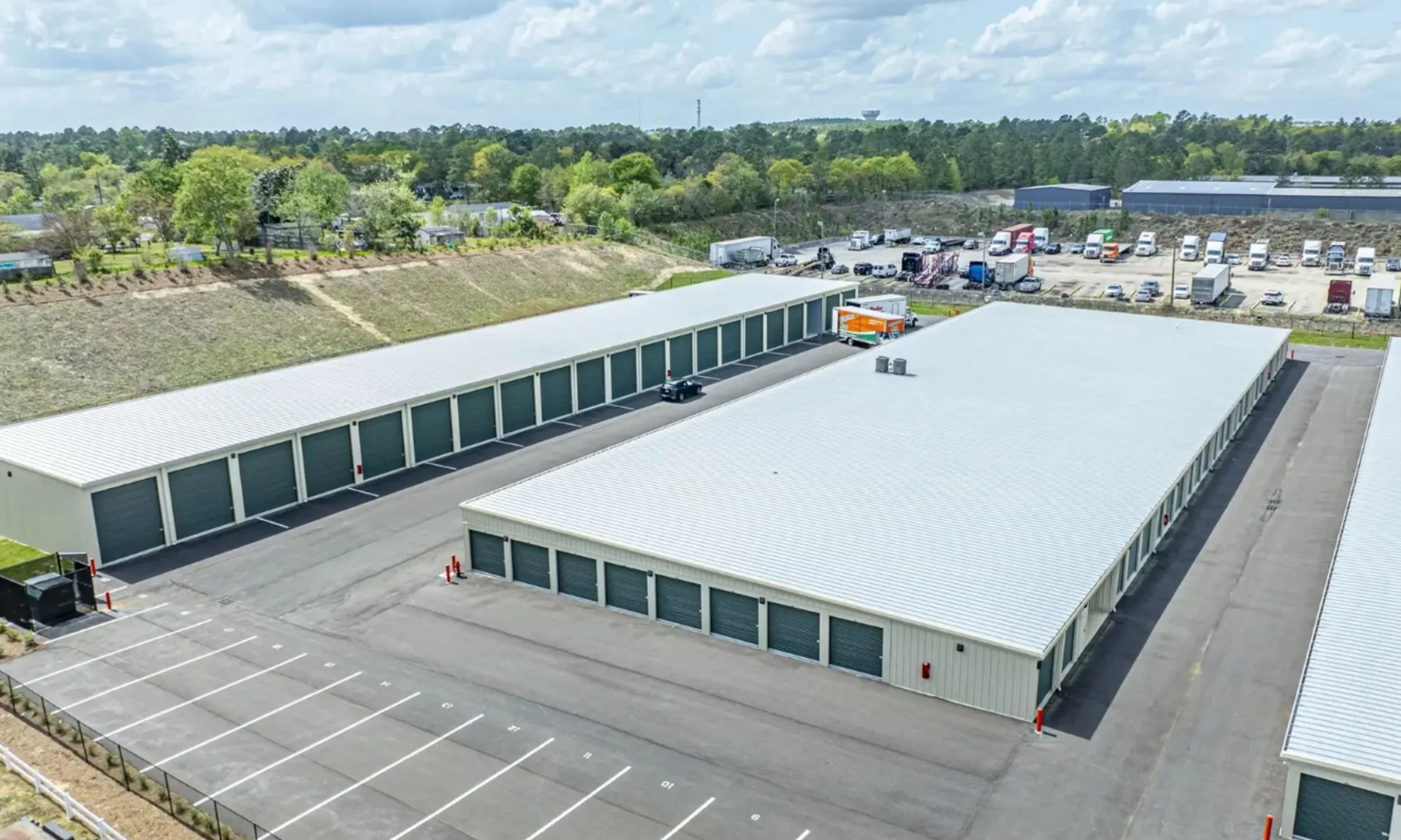 Aerial view of Public Storage self-storage buildings designed by LAT34 Architecture with drive-up units and efficient site circulation.