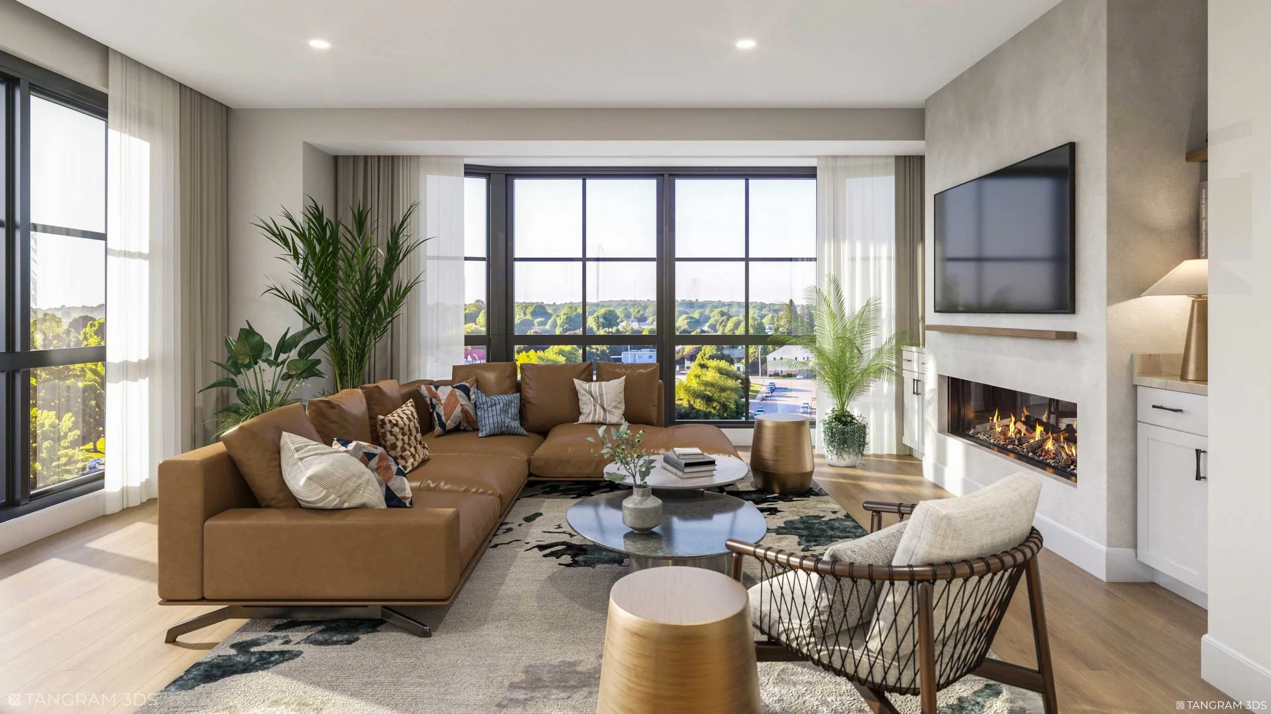 Modern living room with large windows, a tan sectional sofa with decorative pillows, a round coffee table, indoor plants, and a fireplace with a mounted TV, bright with natural light.