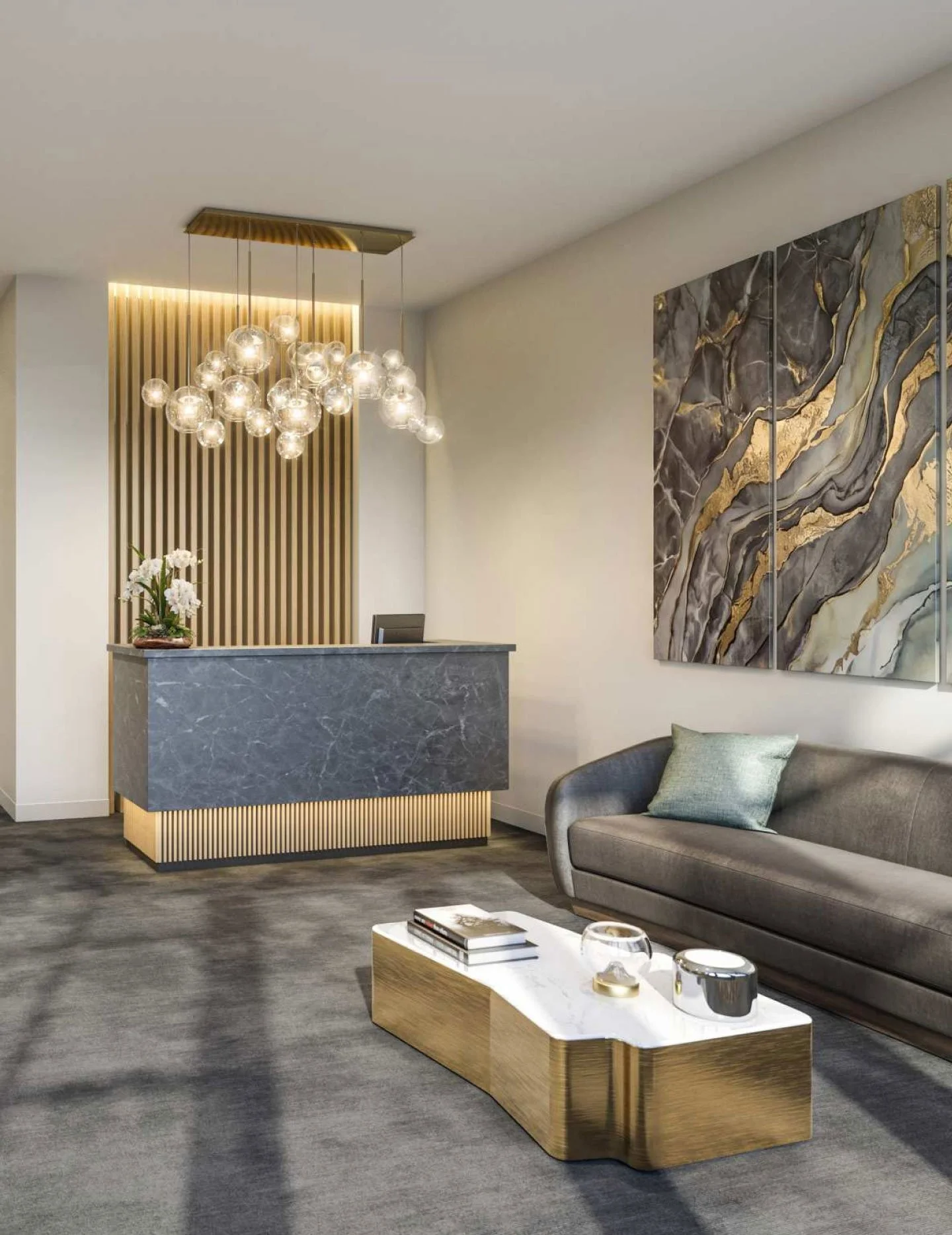 Modern hotel lobby with a reception desk, gray marble finish, a hanging chandelier with multiple glass spheres, abstract marble wall art, and a gray sofa with a green pillow.