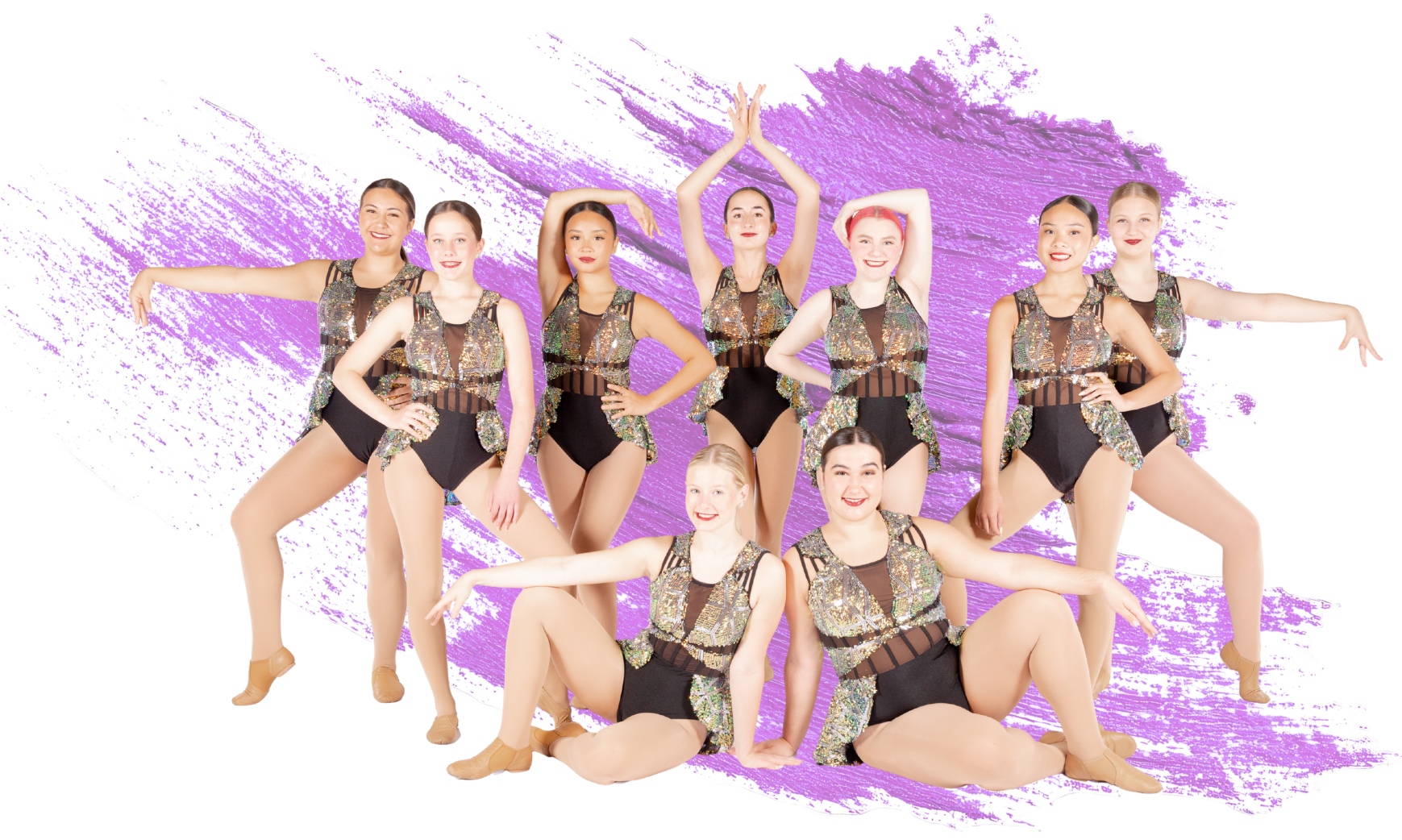 A group of nine young female figure skaters in matching costumes with sequins, posing together in jazz shoes in front of a purple abstract background.