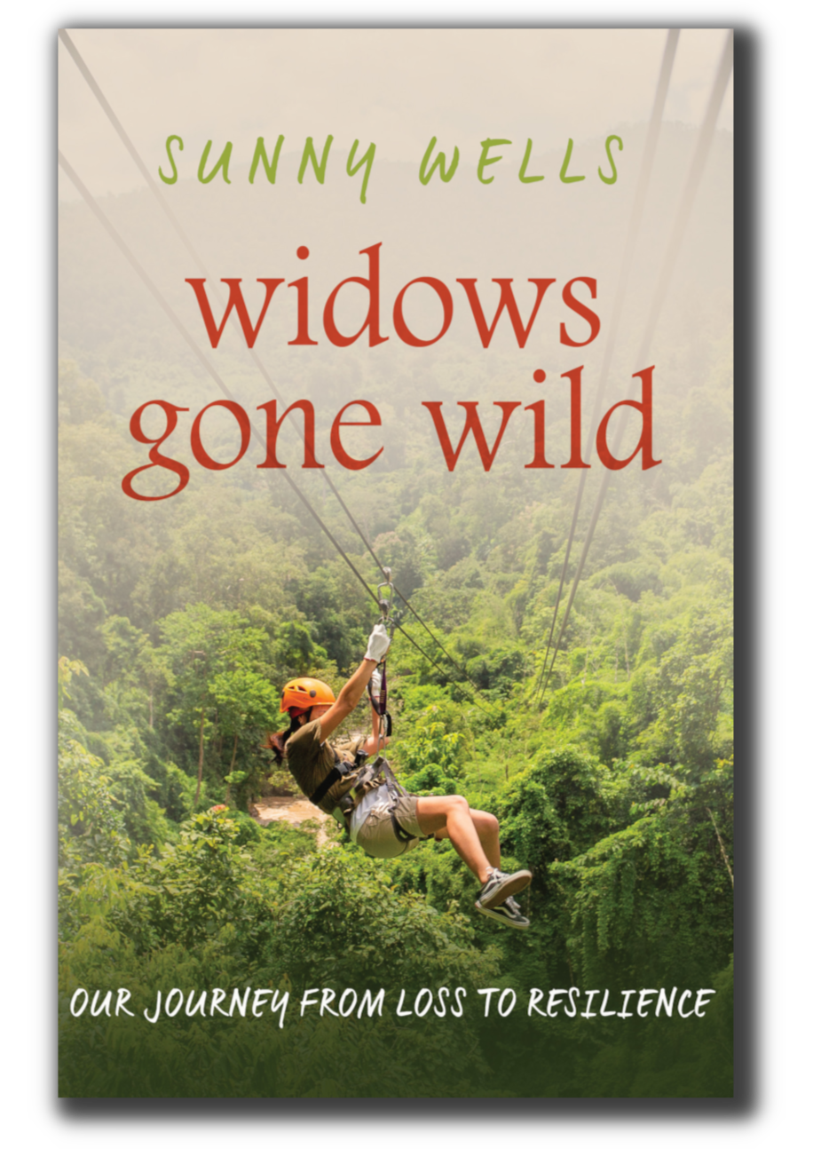 Book cover titled 'Widows Gone Wild' by Sunny Wells, featuring a woman ziplining in a lush green forest, with a subtitle 'Our Journey from Loss to Resilience.'