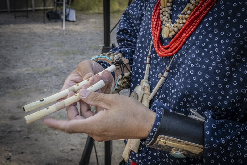 Showing two eagle bone flutes that I made.