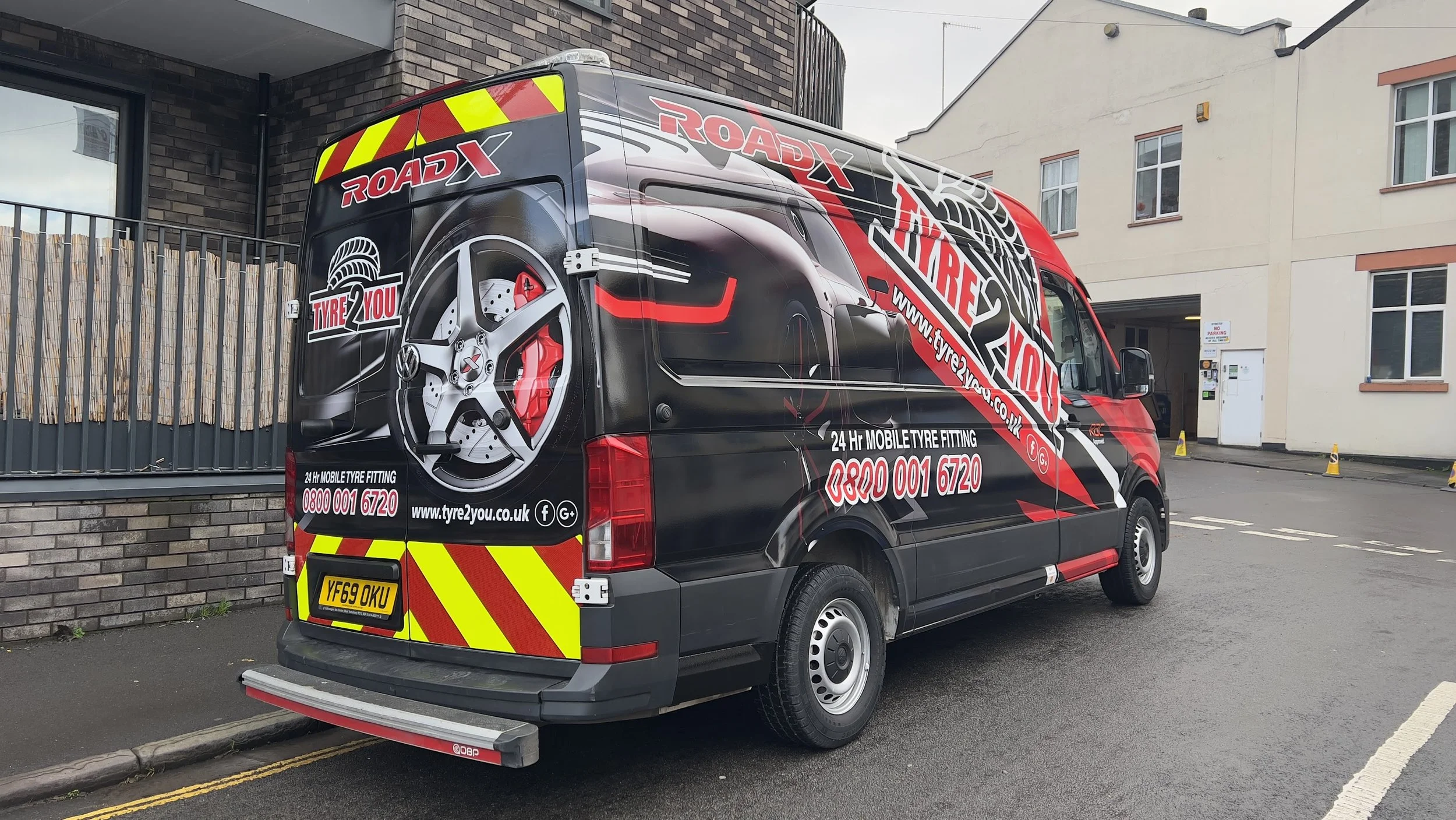 Full vehicle wrap in an eye catching design with reflective chevrons on the rear