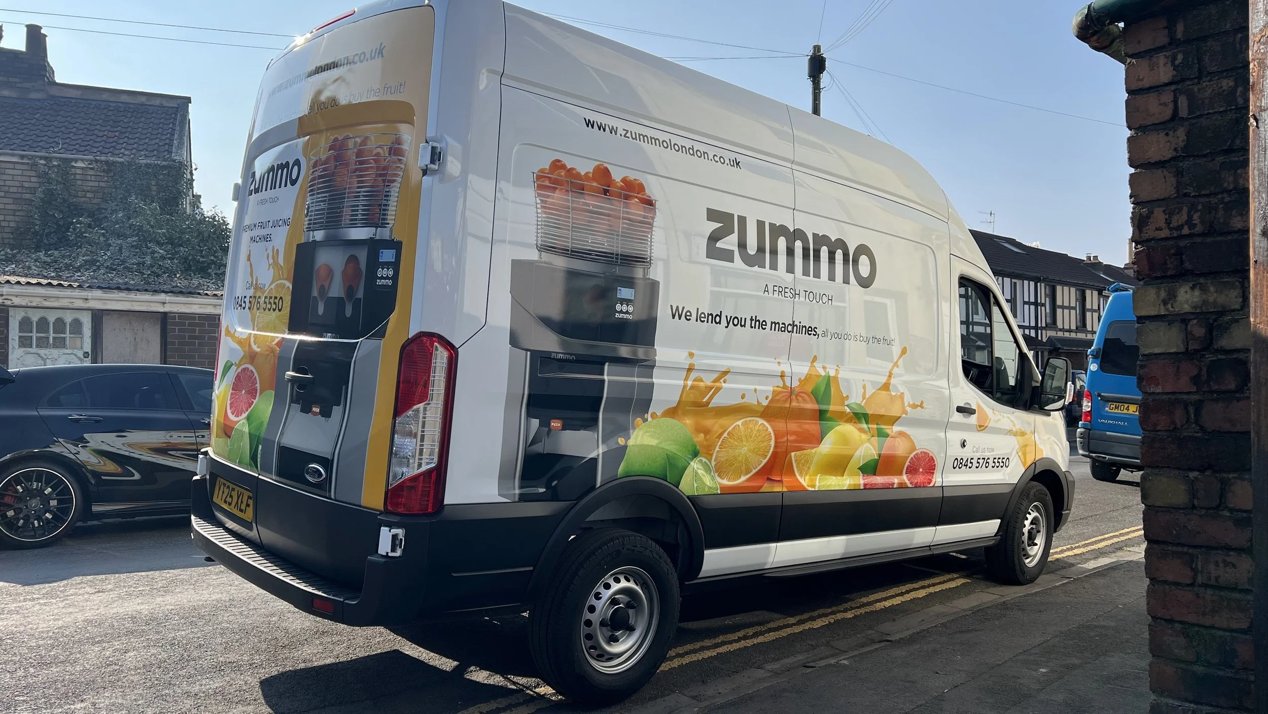 Transit long wheelbase partial vehicle wrap for Zummo, a fruit juicing machine company