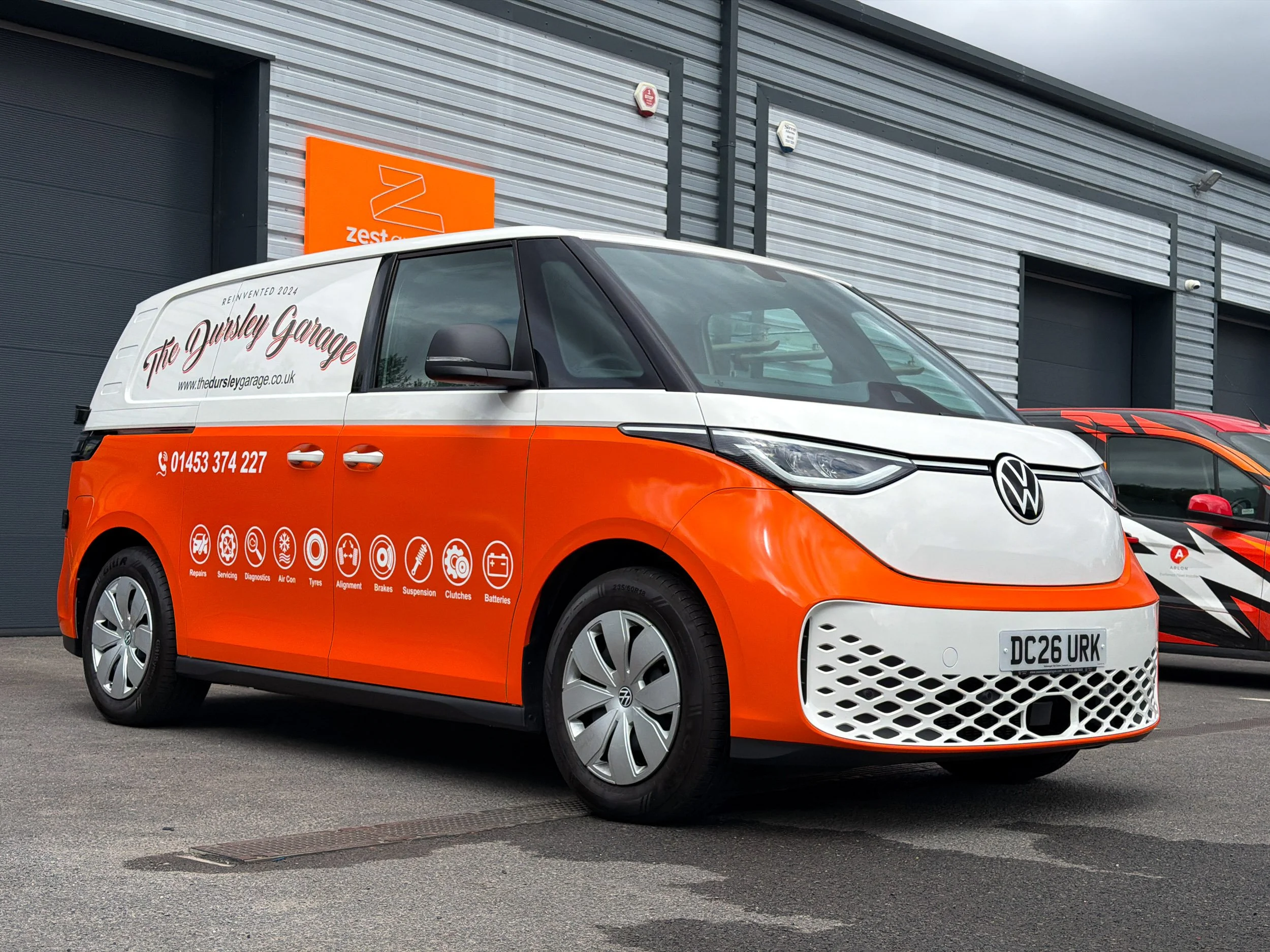 A Volkswagen ID Buzz cargo partial wrap with printed graphics for the Dursley Garage