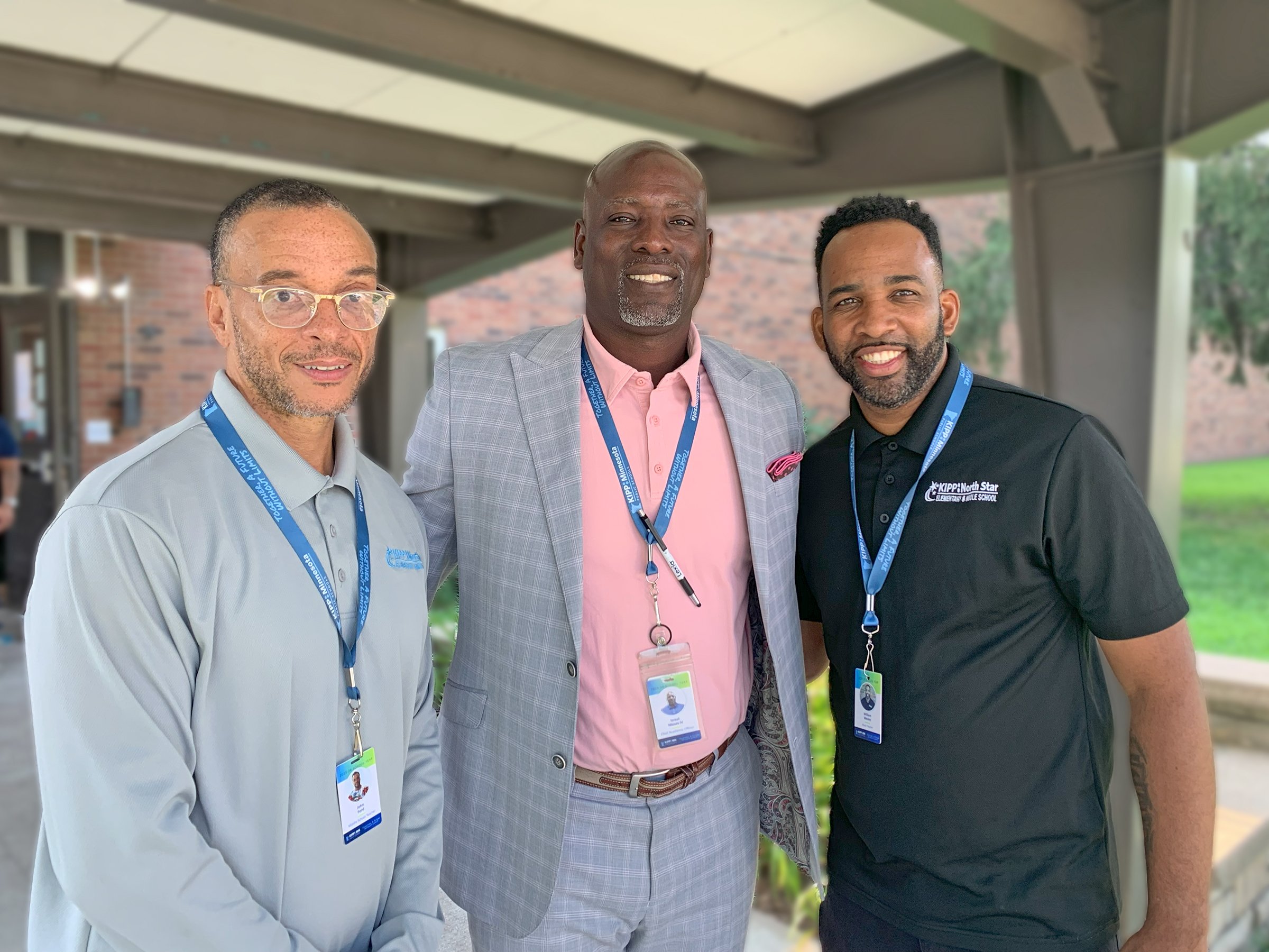 Three of our team members welcoming students back on the first day of school.