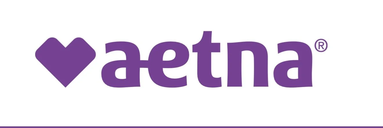 A purple heart symbol next to the stylized text 'aetna' in purple with a registered trademark symbol.