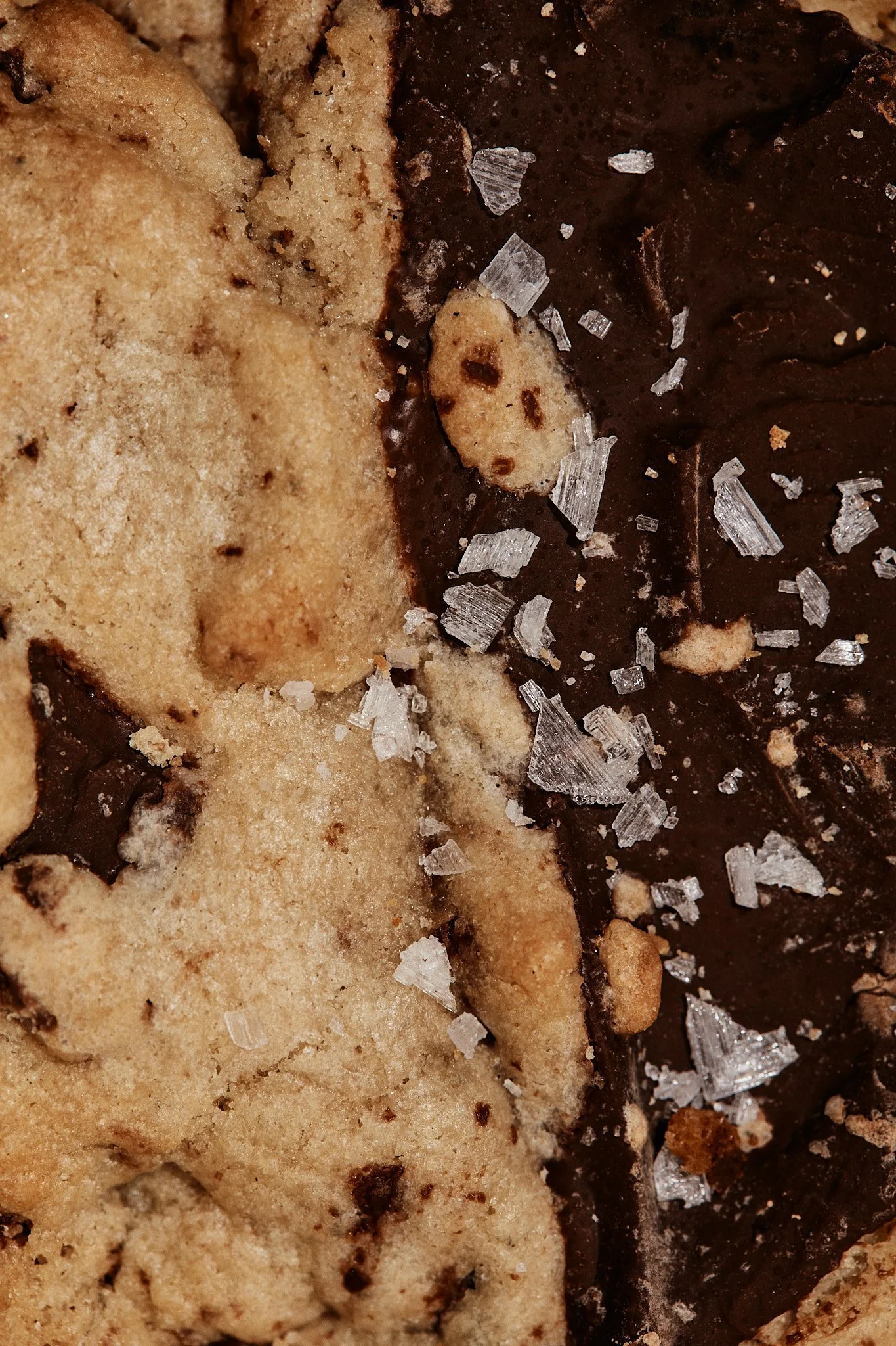 Close-up of chocolate chip cookies with coarse sea salt.