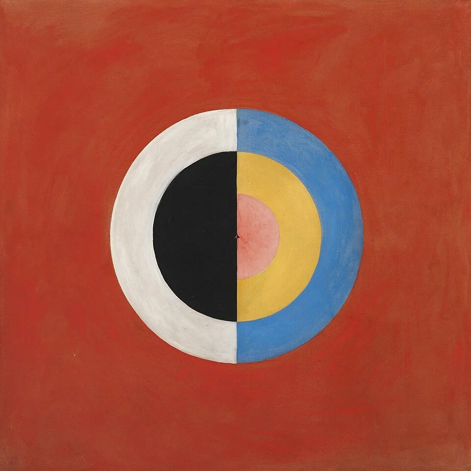 Concentric circle abstract painting in red, blue, and yellow