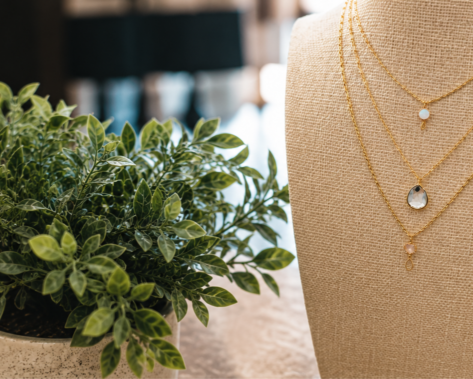 Custom layered gold necklaces with pendants from Amy's Jewelry Box