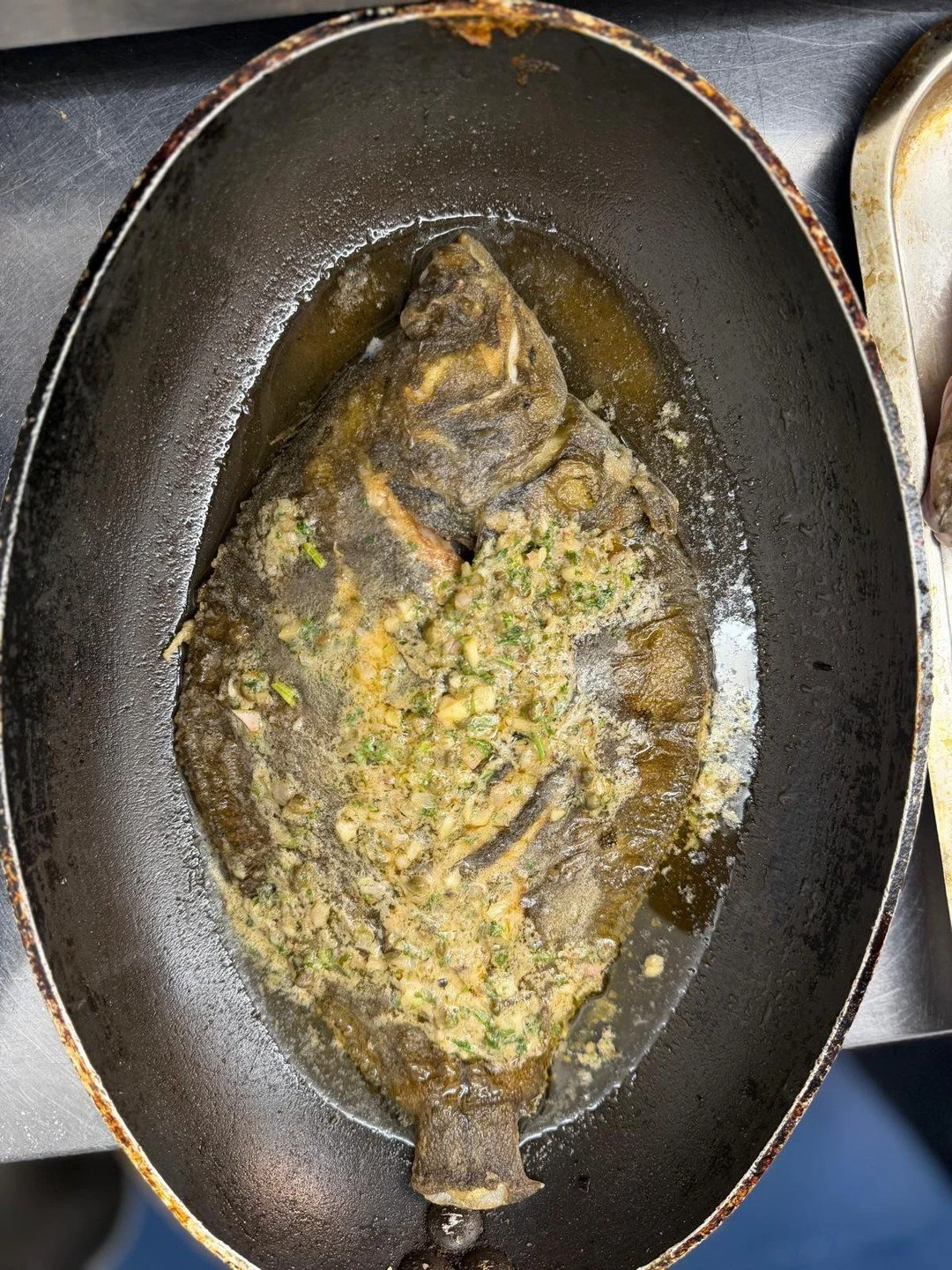 Whole grilled plaice with anchovy butter, waiting to make its way to the dining room.⁠
⁠
Simple ingredients. Cooked with care. Served at their best.⁠
⁠
#ButchersArmsLlanddarog #ButchersArms #CarmarthenshirePub #FreshFish #SustainableFishing #LocalPro