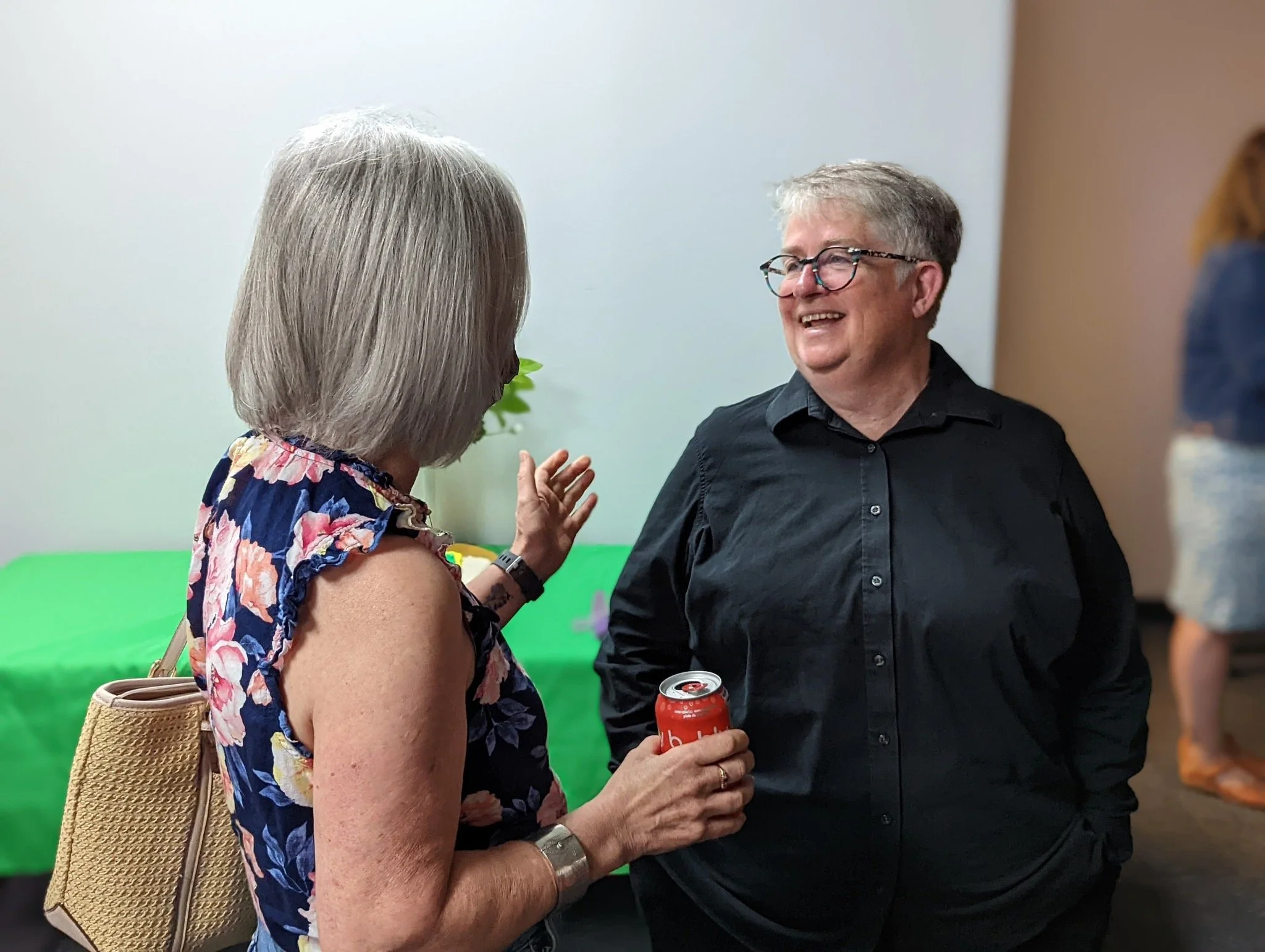 Marianne Alto smiles while meeting a supporter.