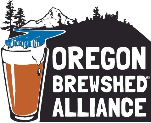 Oregon Brewshed Alliance logo featuring a pint of beer with foam, mountain and trees silhouette.