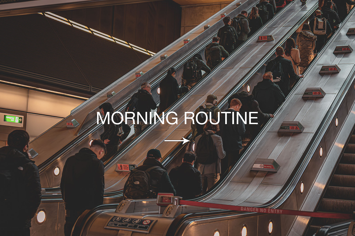 People riding an escalator at Canary Wharf underground station with a 'MORNING ROUTINE' overlay text.