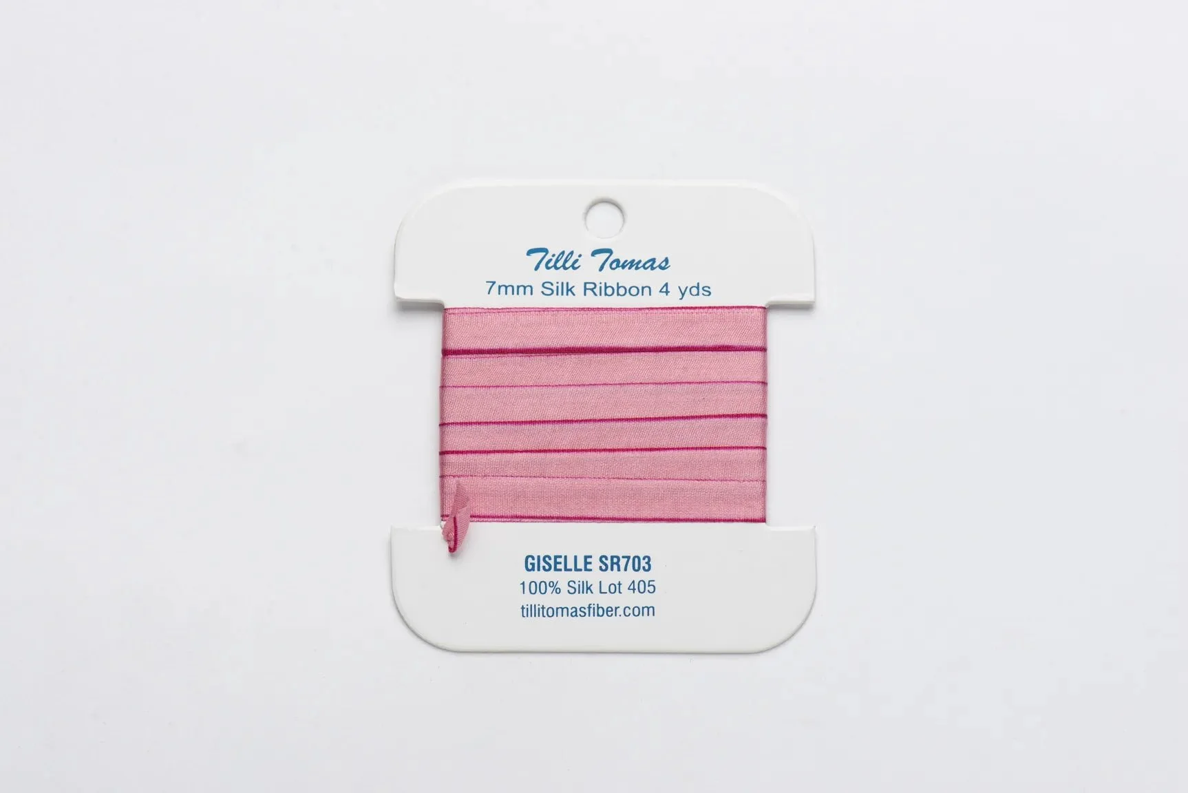 Pink silk ribbon with thin dark pink stripes, displayed on a white holder with blue text, labeled 'Tilli Tomas', 7mm size, 4 yards long, with additional product and website information.