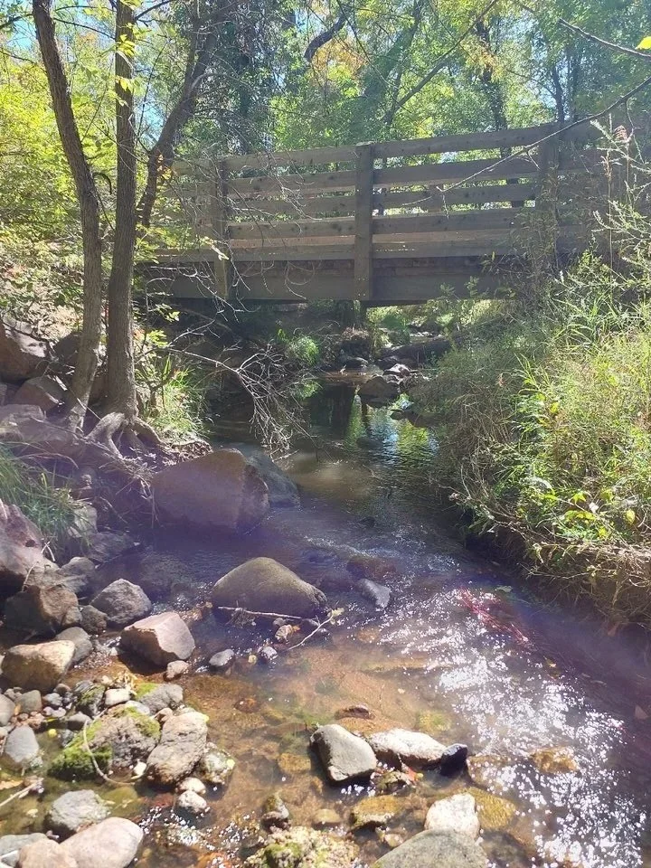 Water running through El Paso County under a bridge