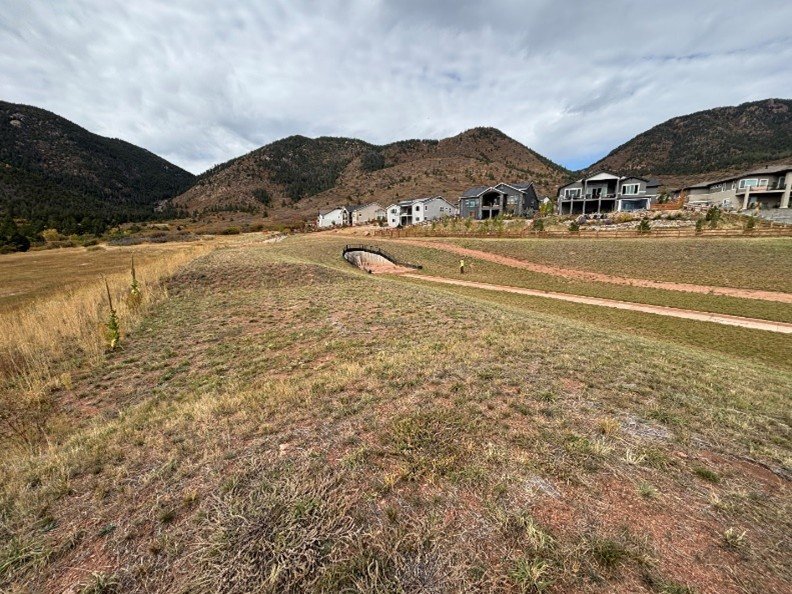 A waterway in a residential development in central El Paso County