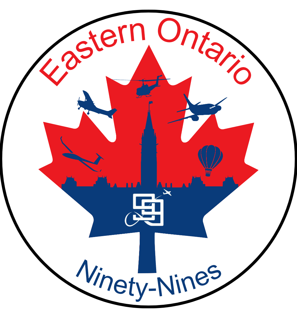 A circular emblem for Eastern Ontario Ninety-Nines, featuring a red and blue maple leaf, silhouettes of aircraft, helicopters, a hot air balloon, and a skyline with a tall building and a sculpture, with the text "Eastern Ontario Ninety-Nines" around the top and bottom.
