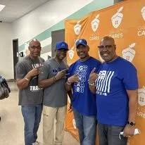 Fraternity brothers posing for a photo after a day of service at Oak City Cares event in Raleigh, NC.